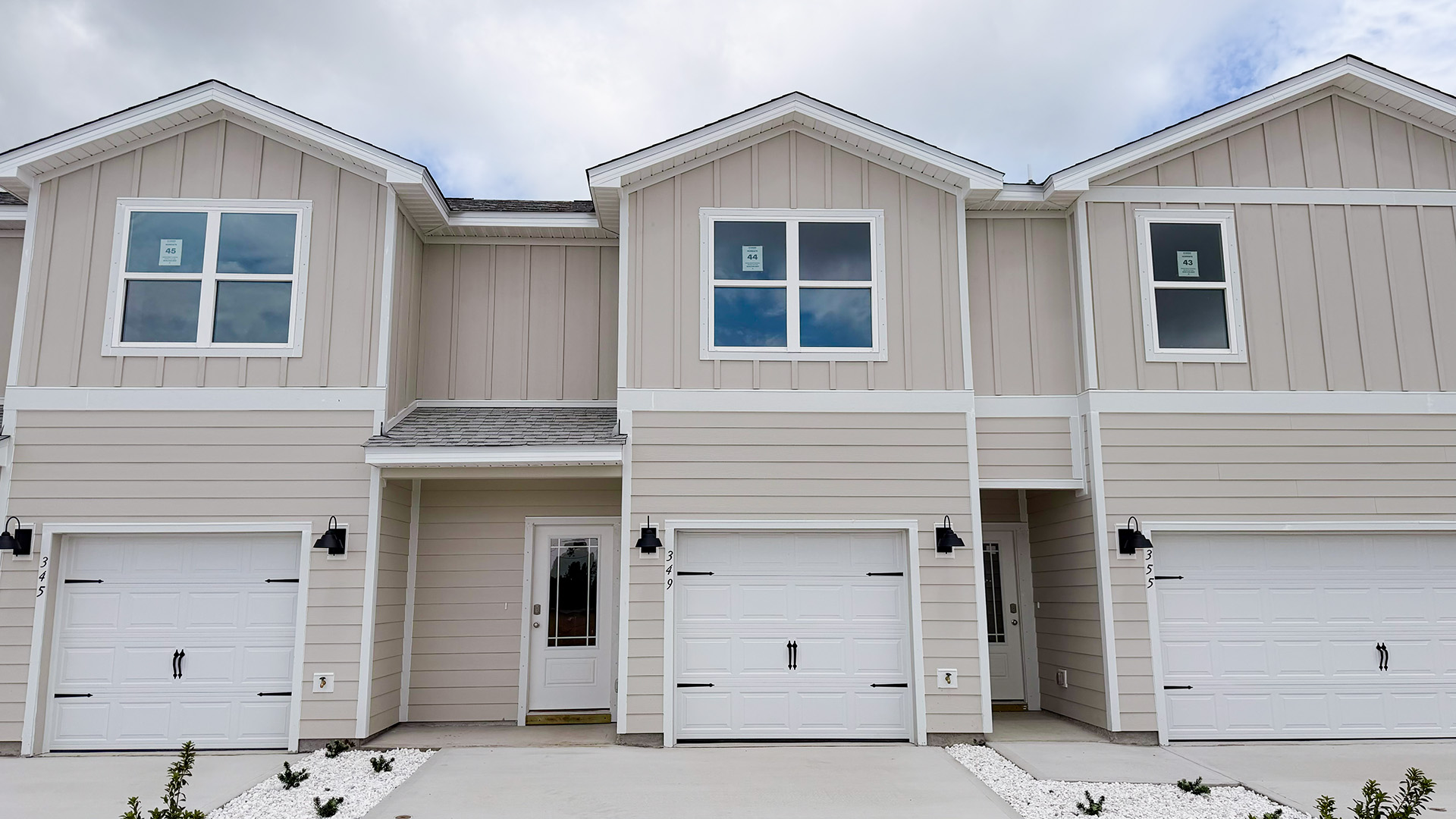 Sabal townhome interior unit with Hardie board siding and single car garage.