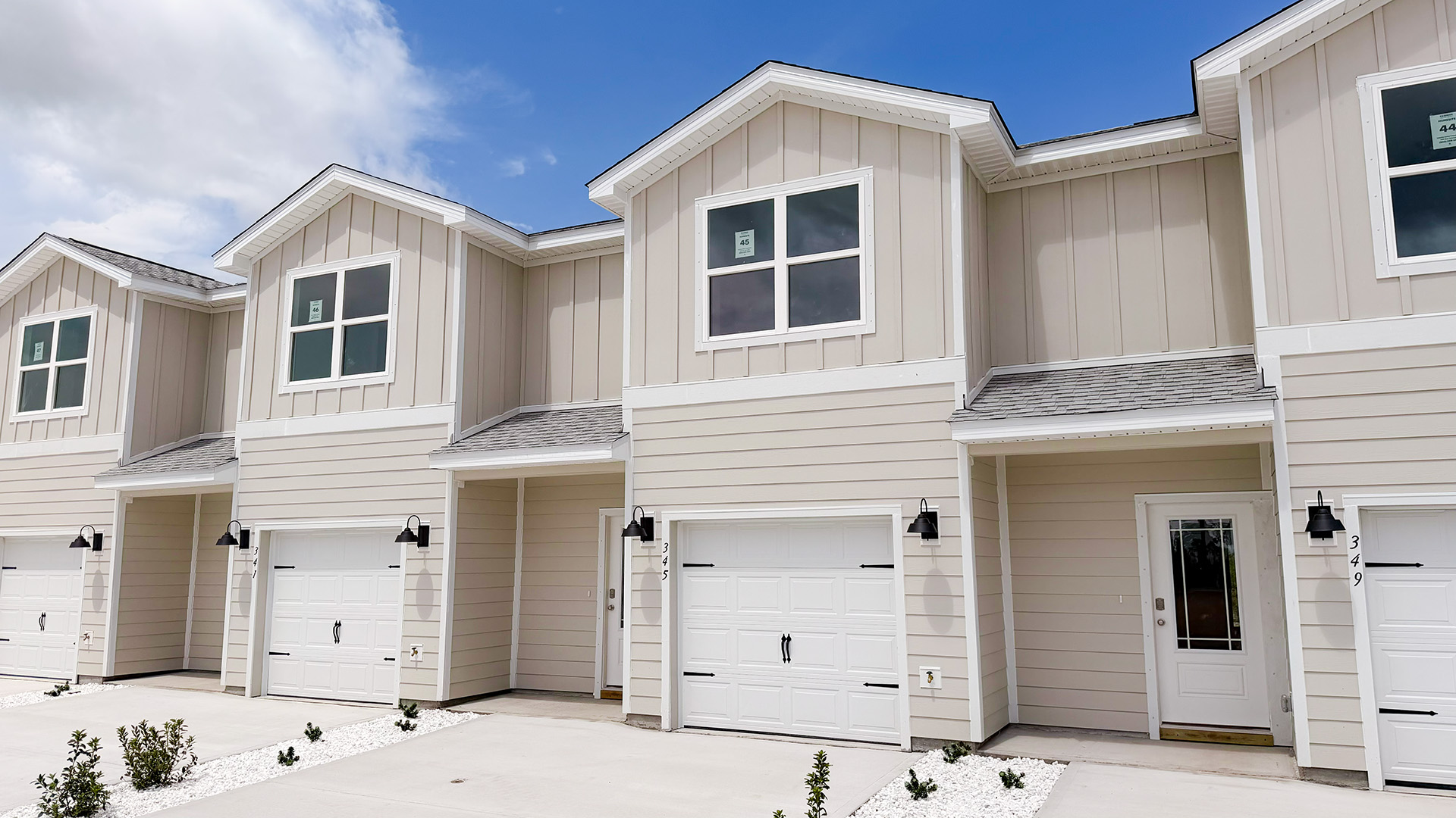 Sabal townhome with single car garage and Hardie siding.