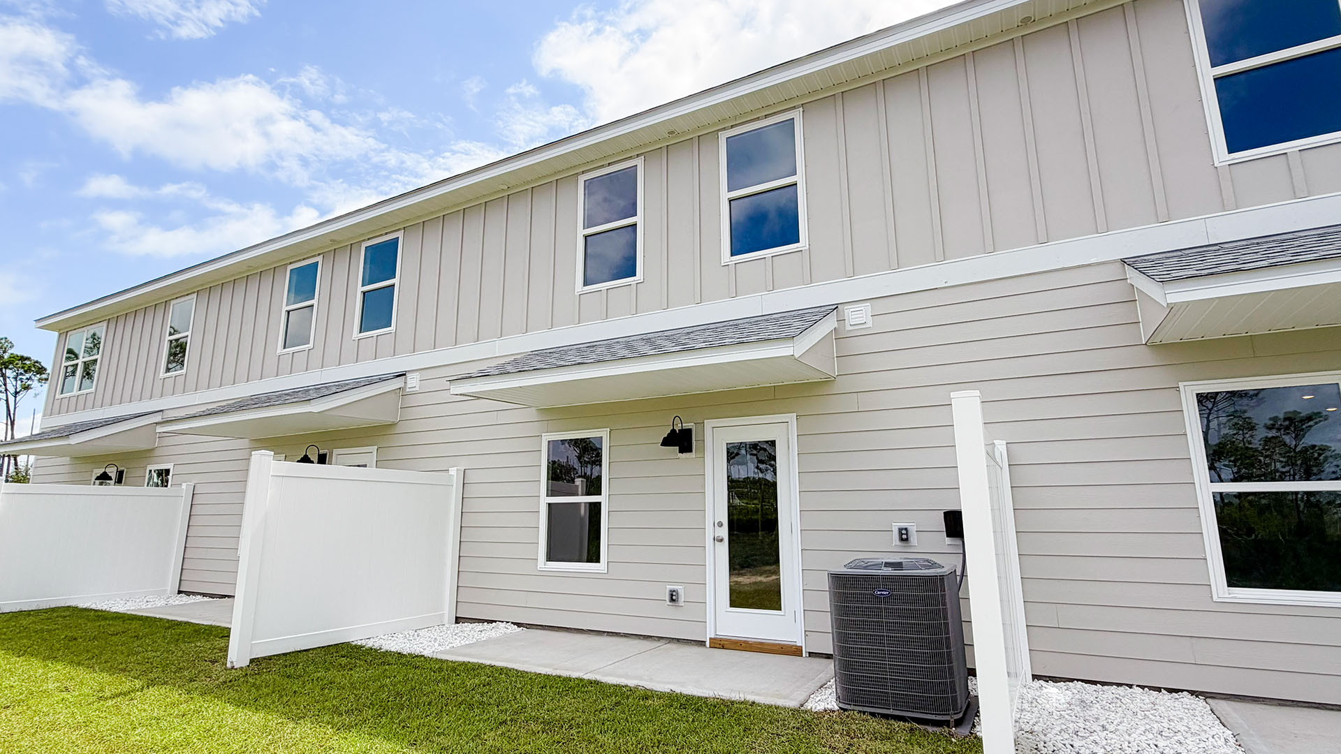 Sabal Townhome units rear of home with covered patios and partitions.