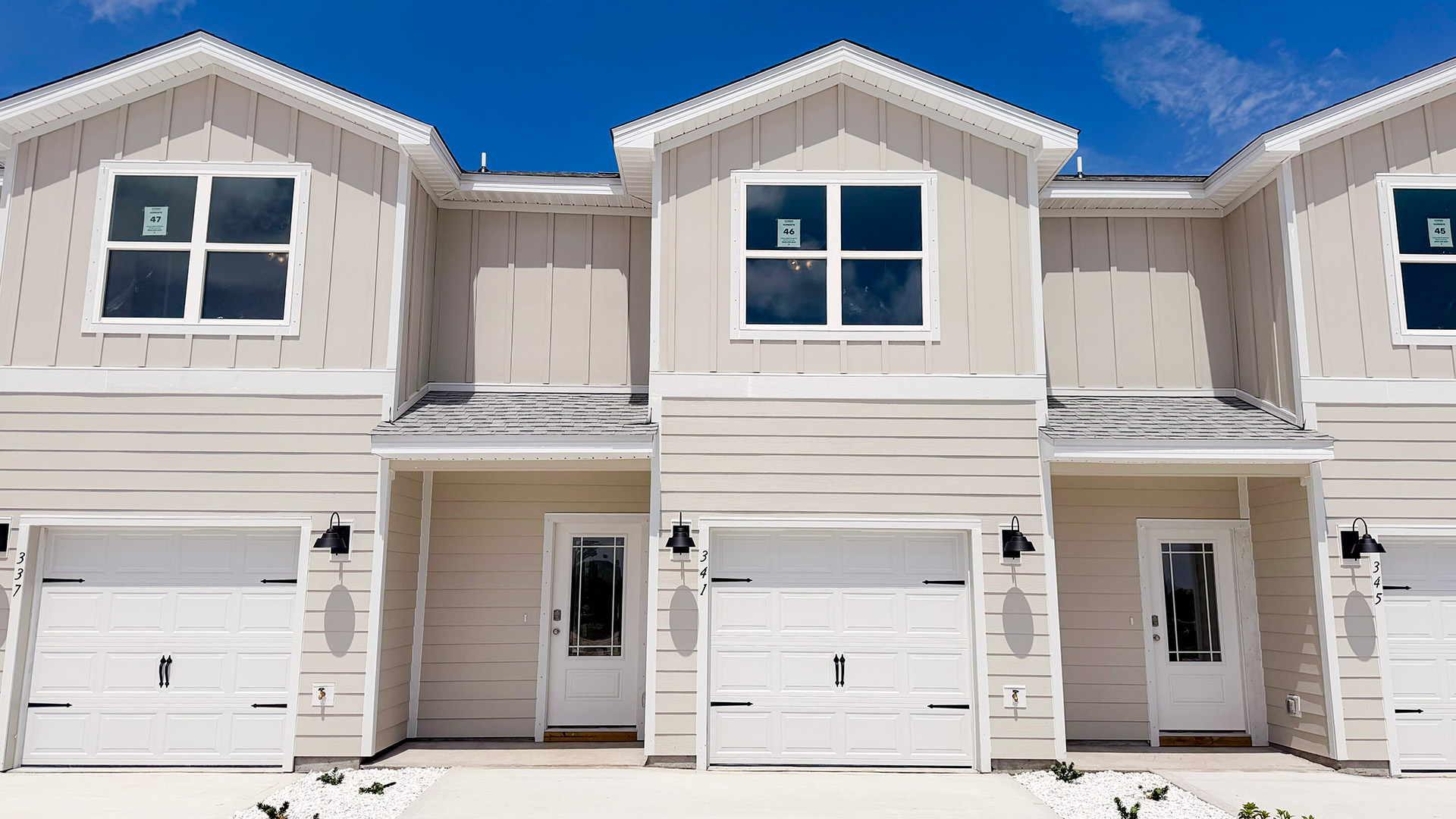 Sabal townhome interior unit with Hardie board siding and single car garage.