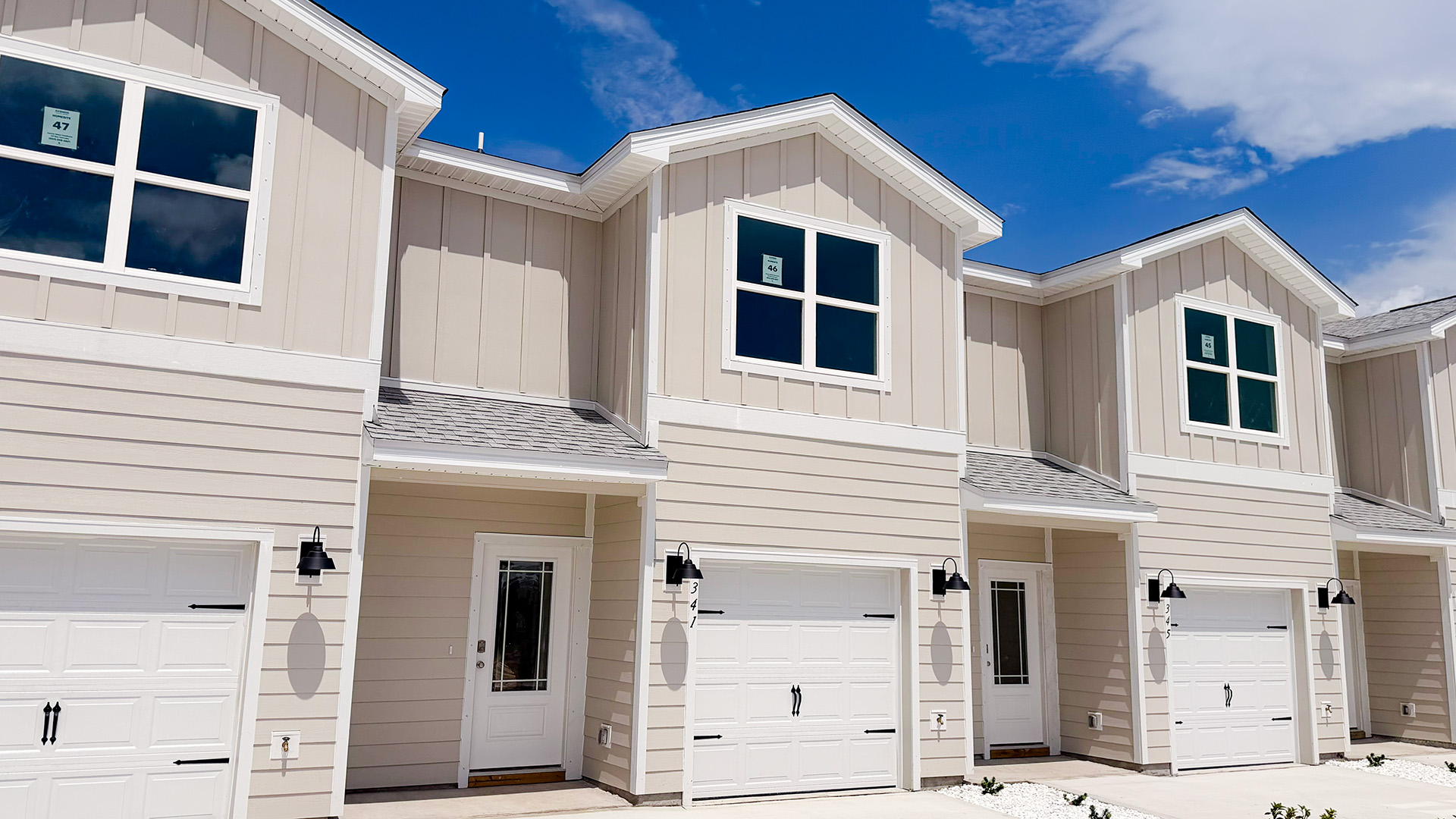 Sabal townhome interior unit with Hardie board siding and single car garage.