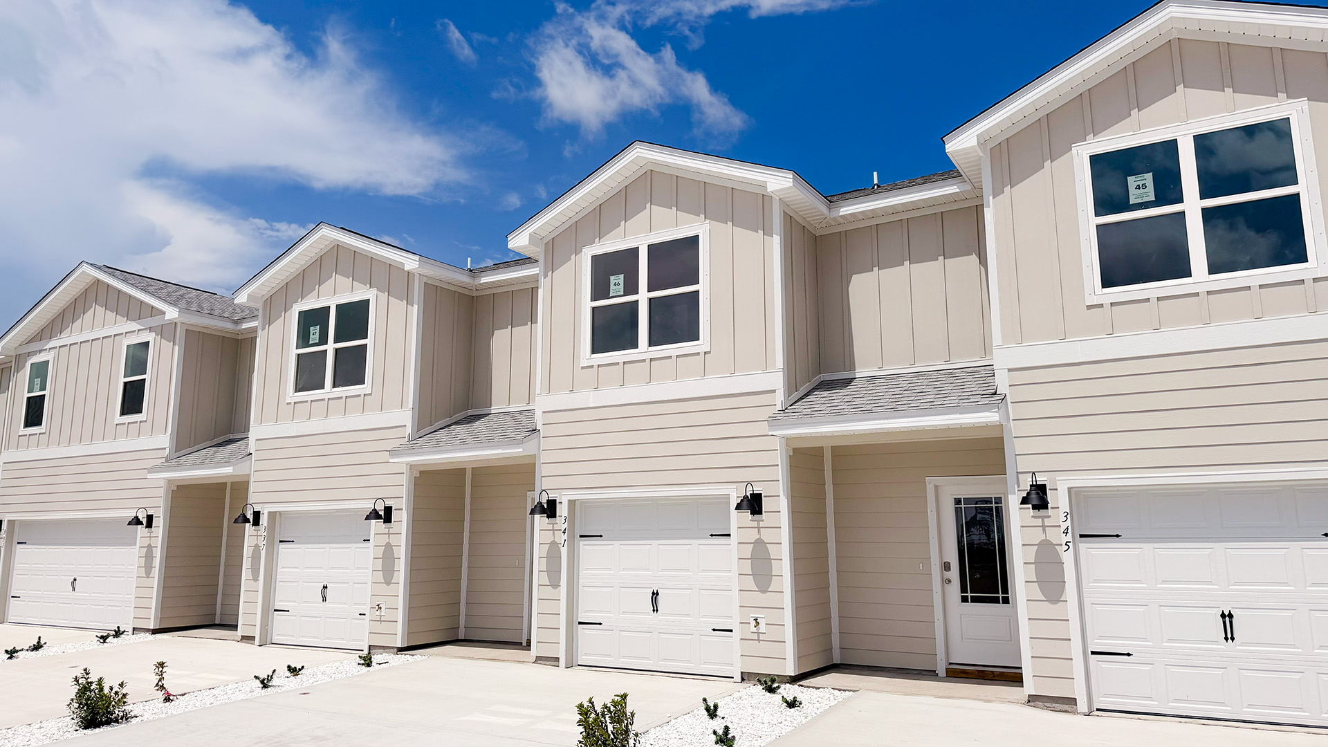Sabal townhome interior unit with Hardie board siding and single car garage.