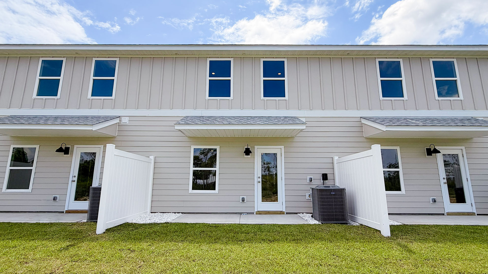 Sabal Townhome units rear of home with covered patios and partitions.