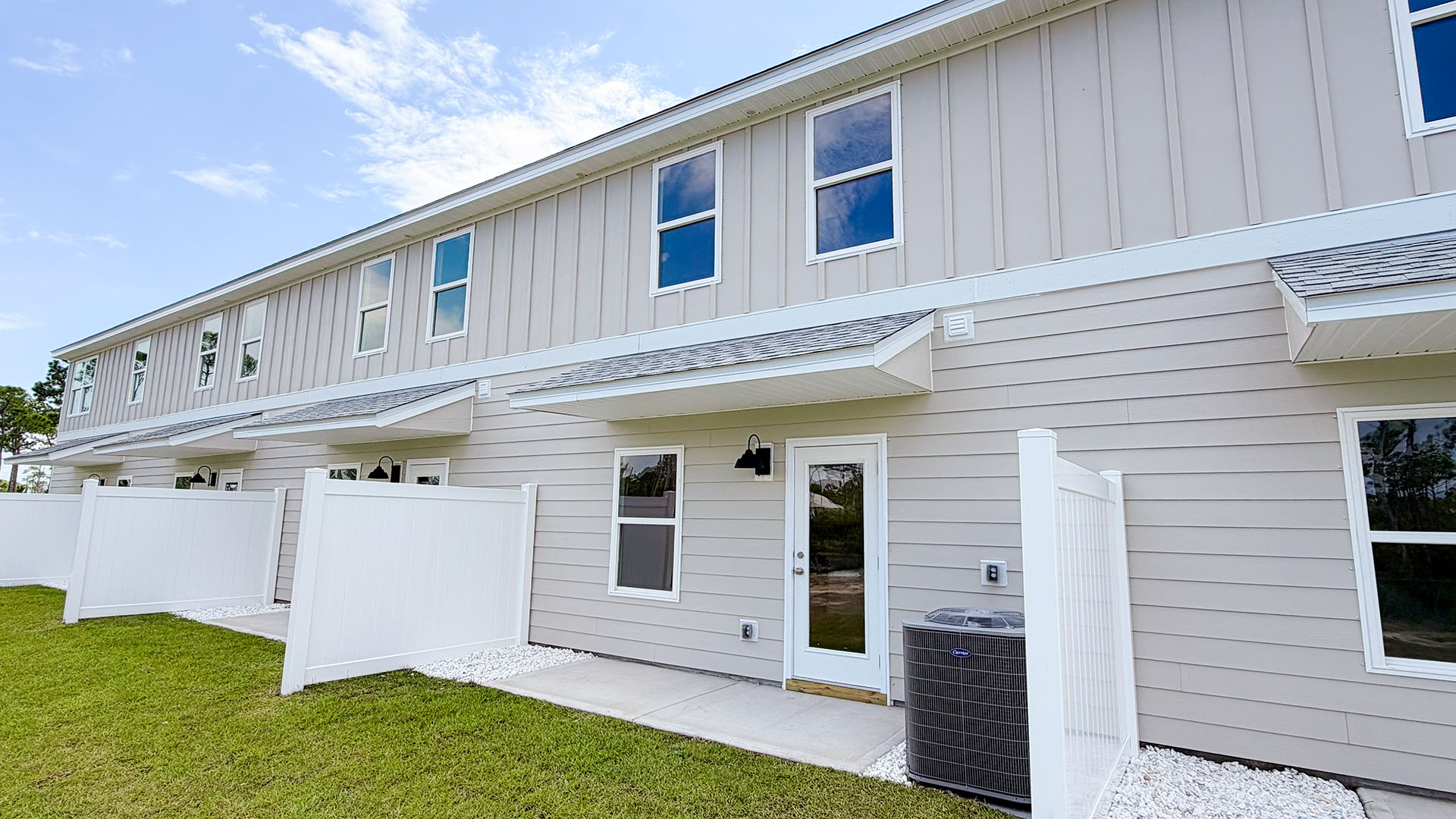 Sabal Townhome units rear of home with covered patios and partitions.
