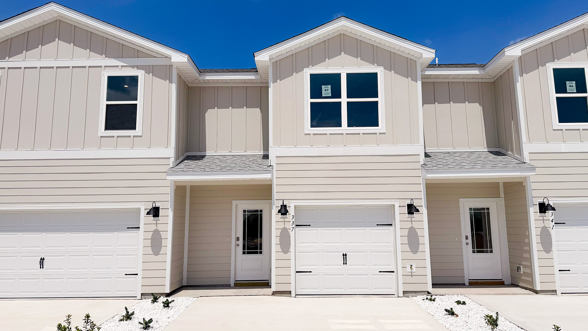 Sabal townhome interior unit with Hardie board siding and single car garage.