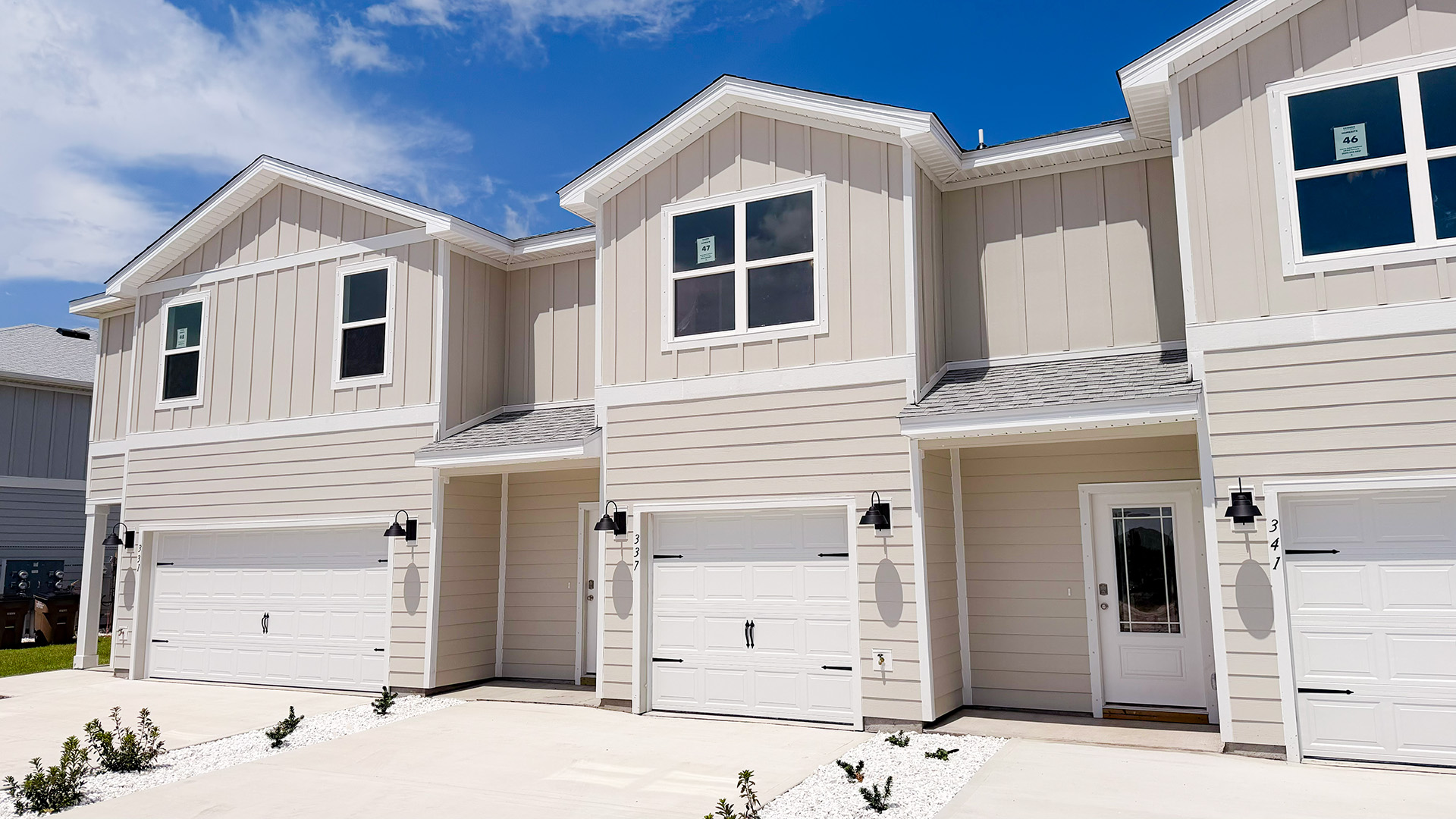 Sabal townhome interior unit with Hardie board siding and single car garage.