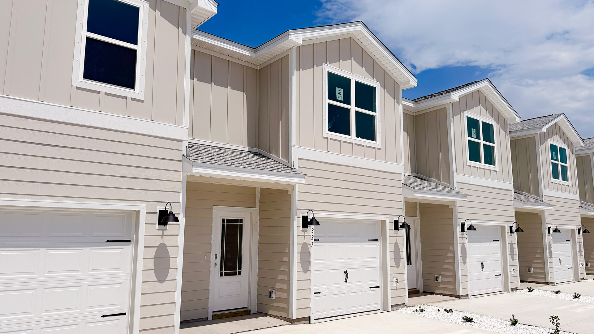Sabal townhome interior unit with Hardie board siding and single car garage.