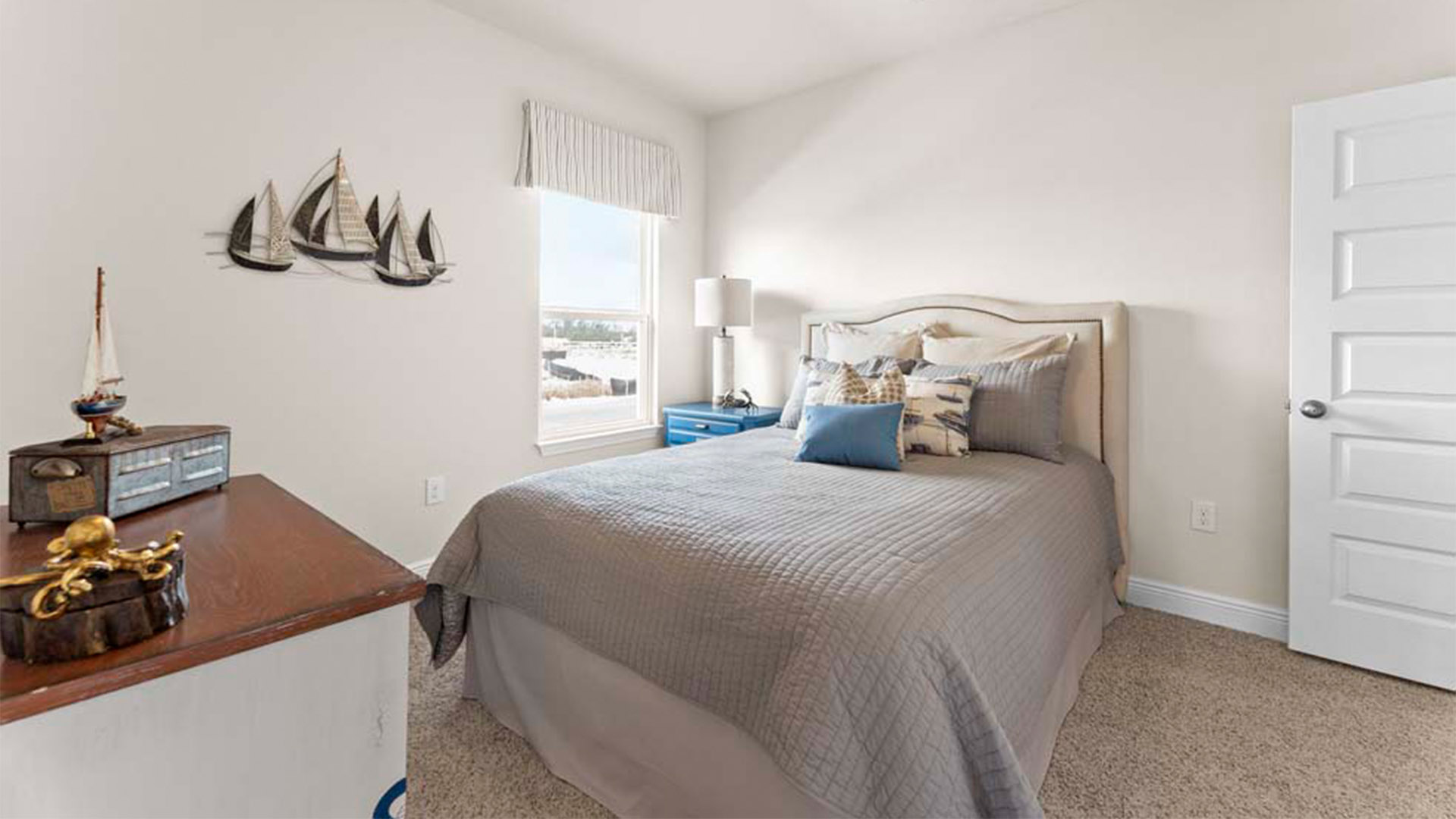 Bedroom with carpet floors and window.