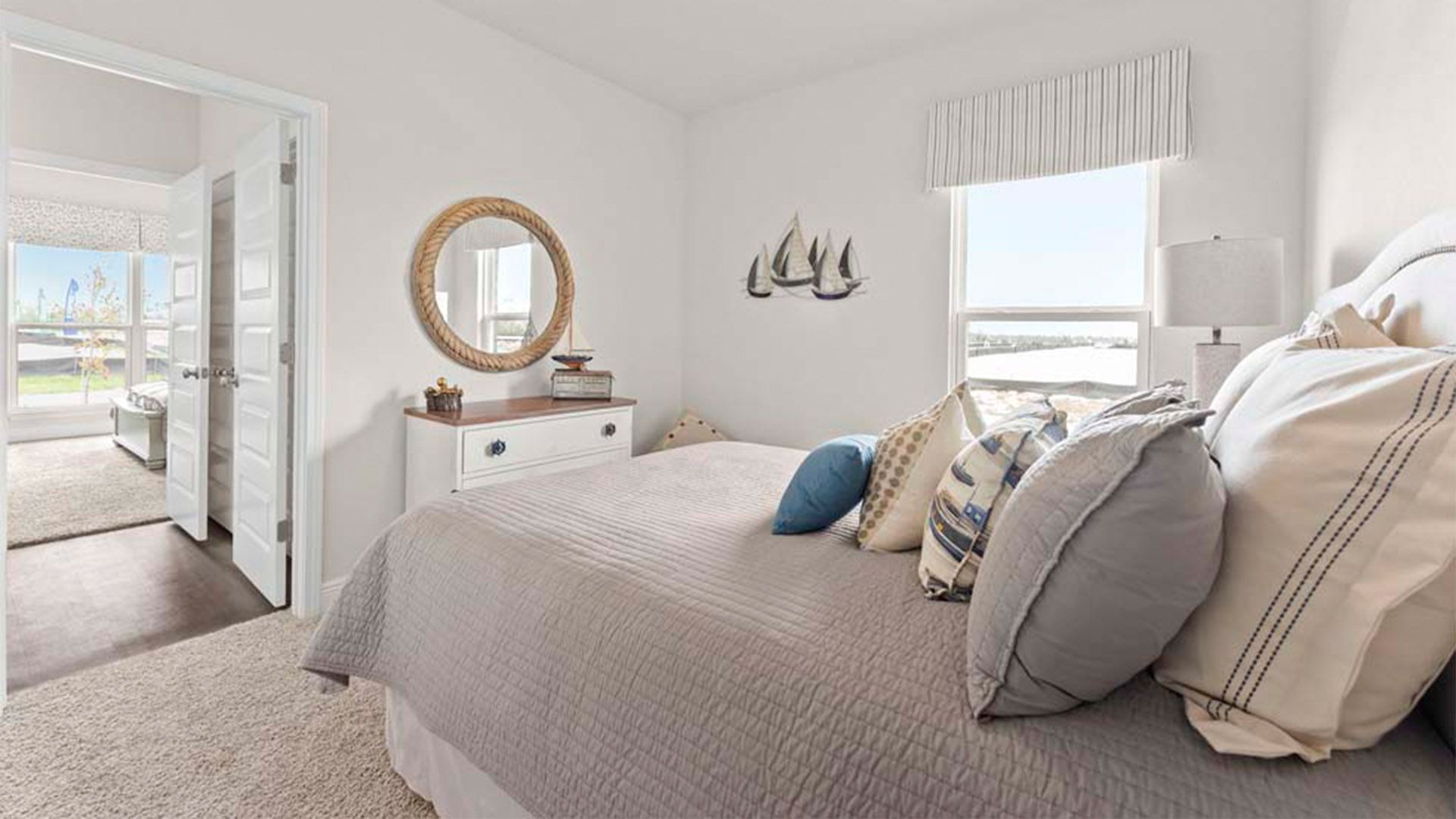 Bedroom with carpet floors and closet and joint bathroom entrance.