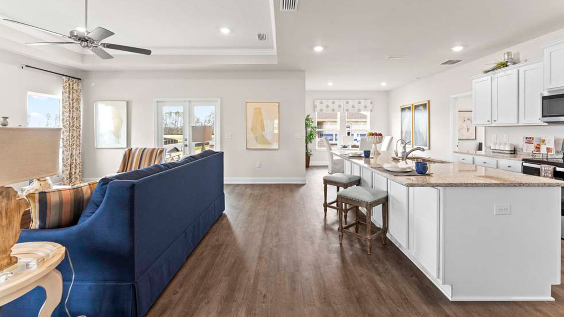 Open kitchen and living room with EVP flooring.