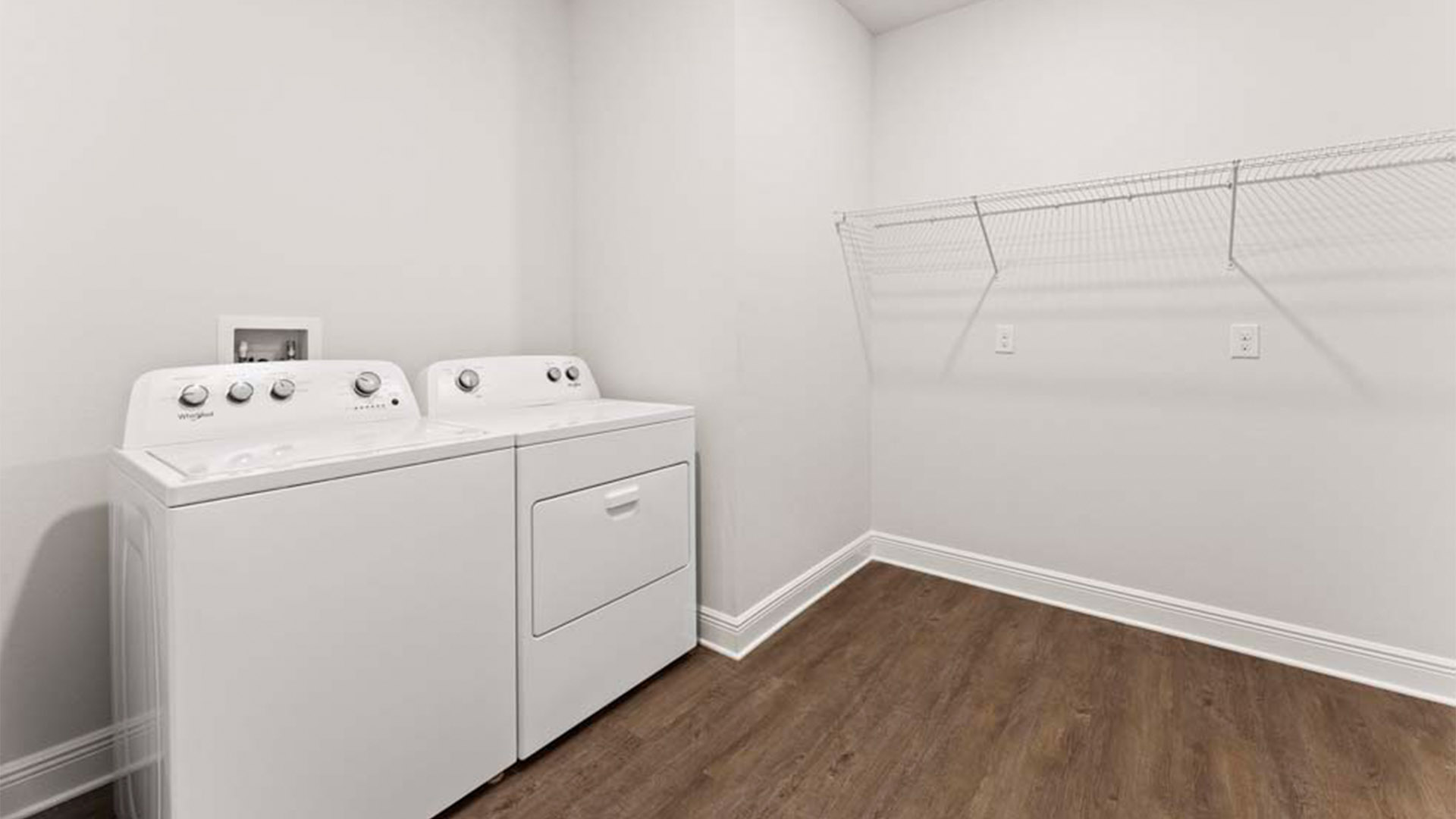 Laundry room with EVP flooring and ventilated shelving.