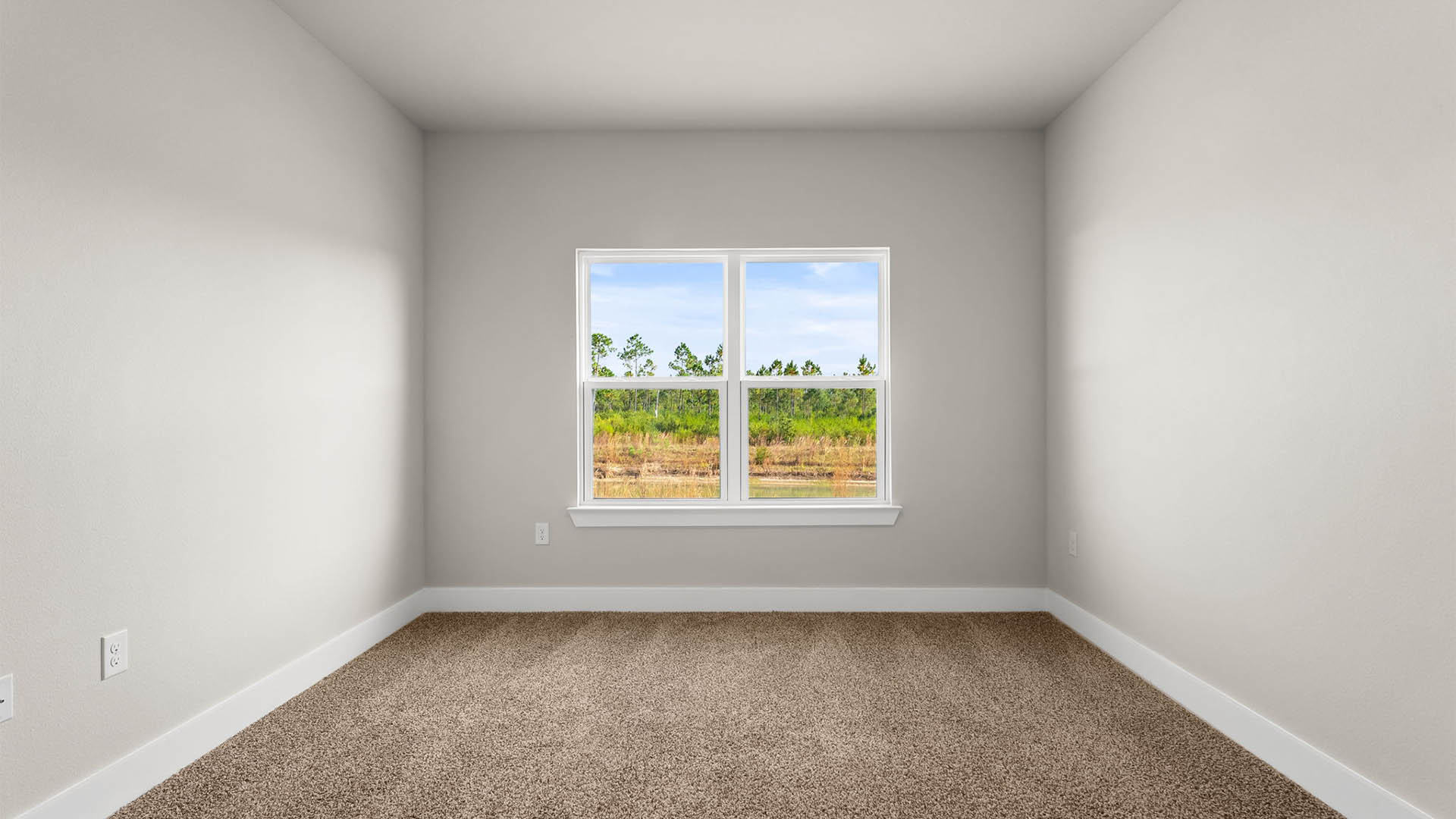Bedroom with carpet floors and window.