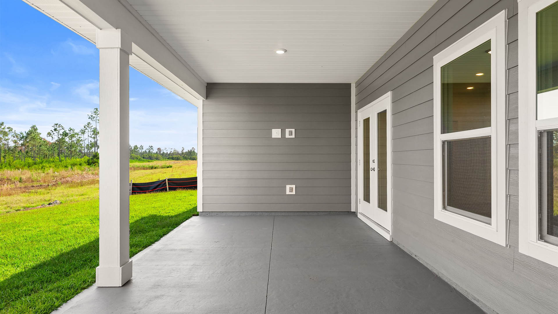 Covered back patio and backyard view.