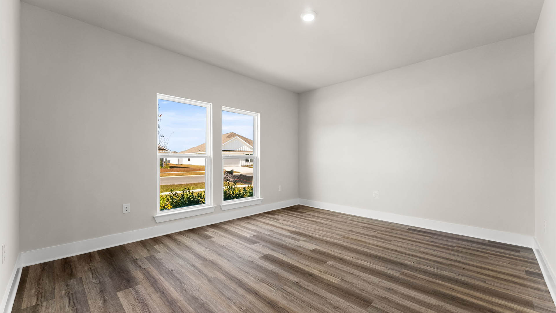 Front study room with EVP flooring and windows.