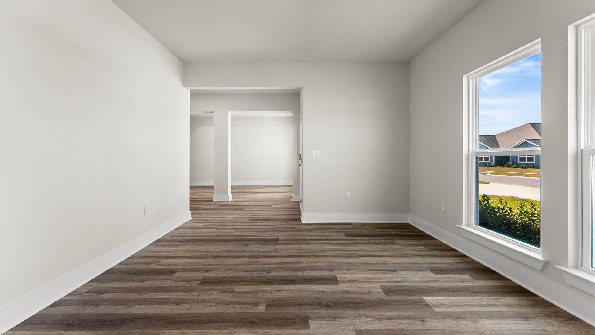 Front study room with EVP flooring and windows.