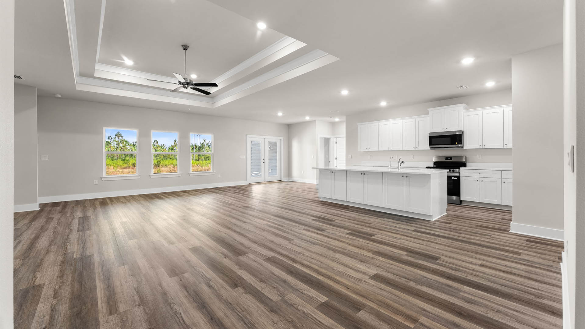Open kitchen and living room with EVP flooring.