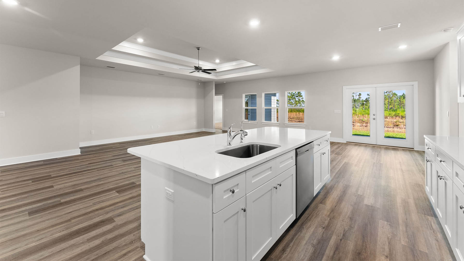 Kitchen view of living room and back door area.