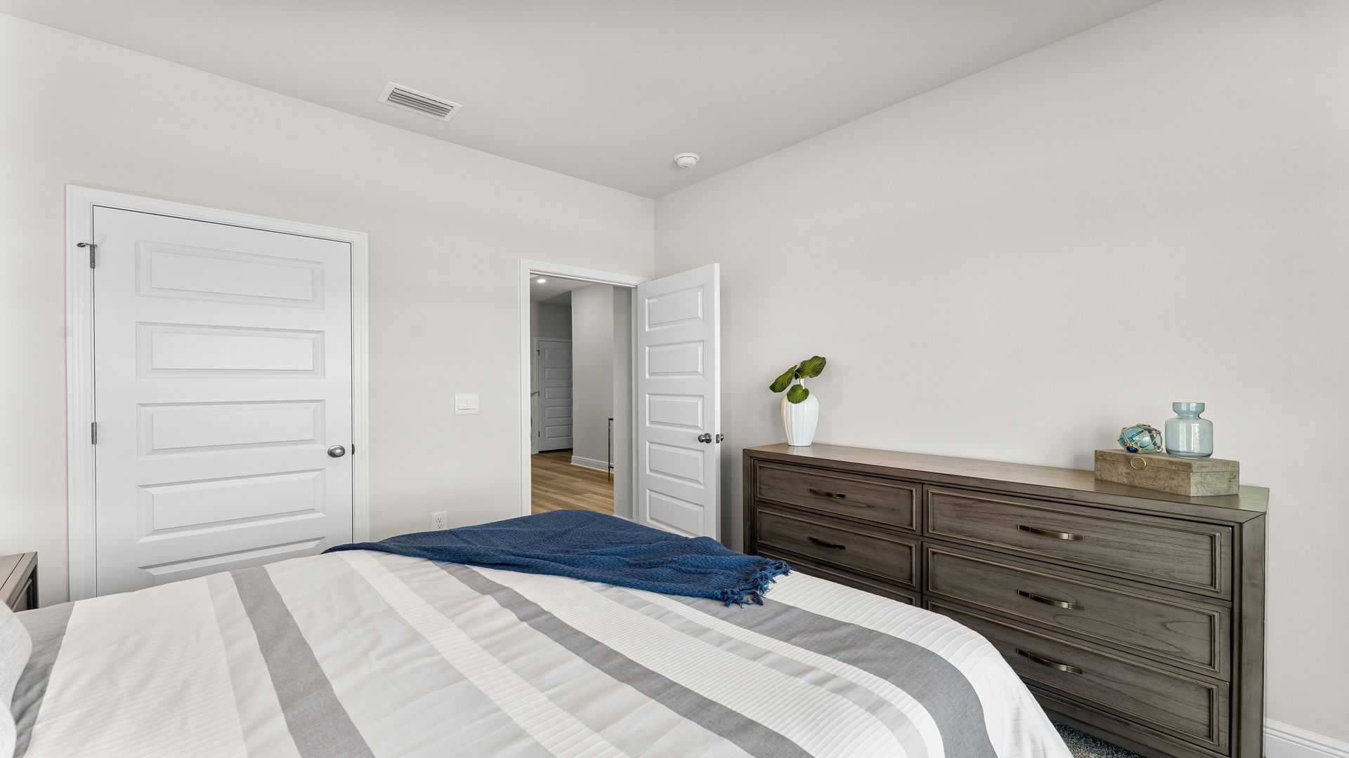 Bedroom with carpet floors and closet.