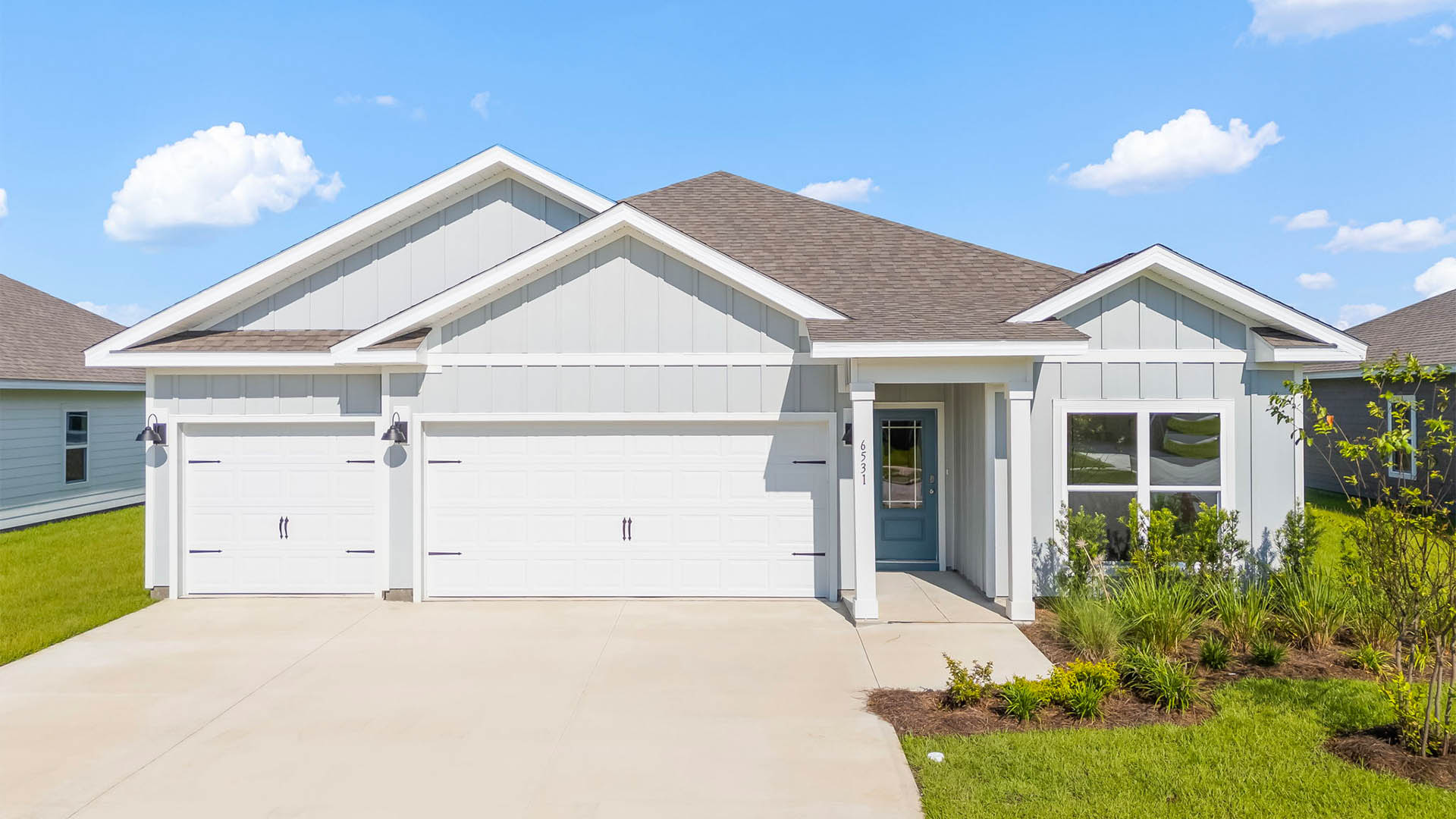 Madison floor plan with 3 car garage and covered front porch.