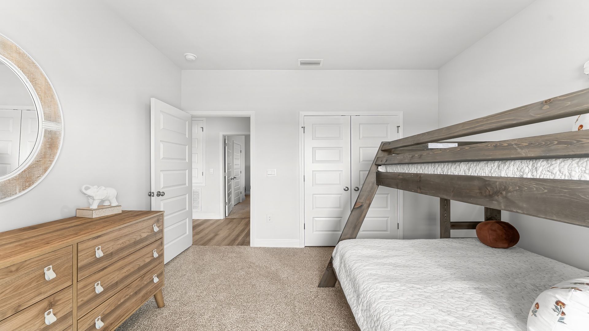 Bedroom with carpet floors and closet.