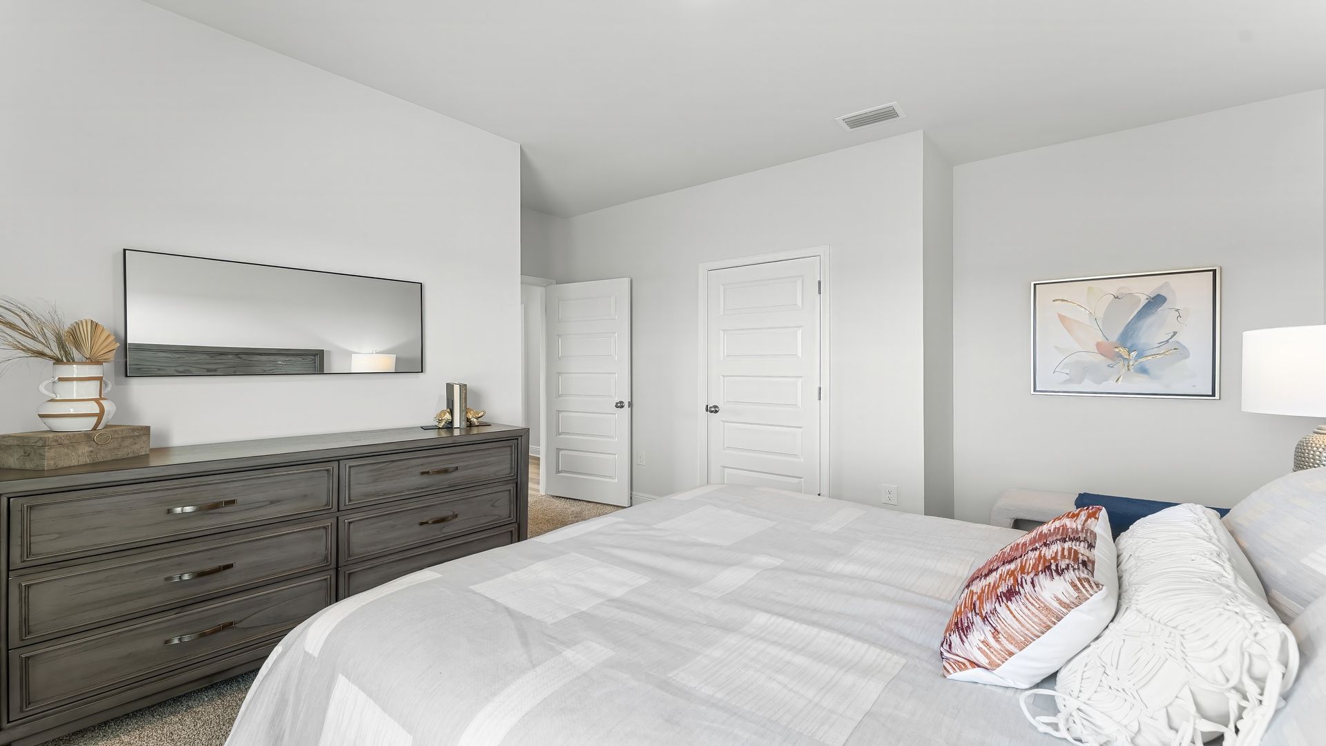 Bedroom with carpet floors and closet.