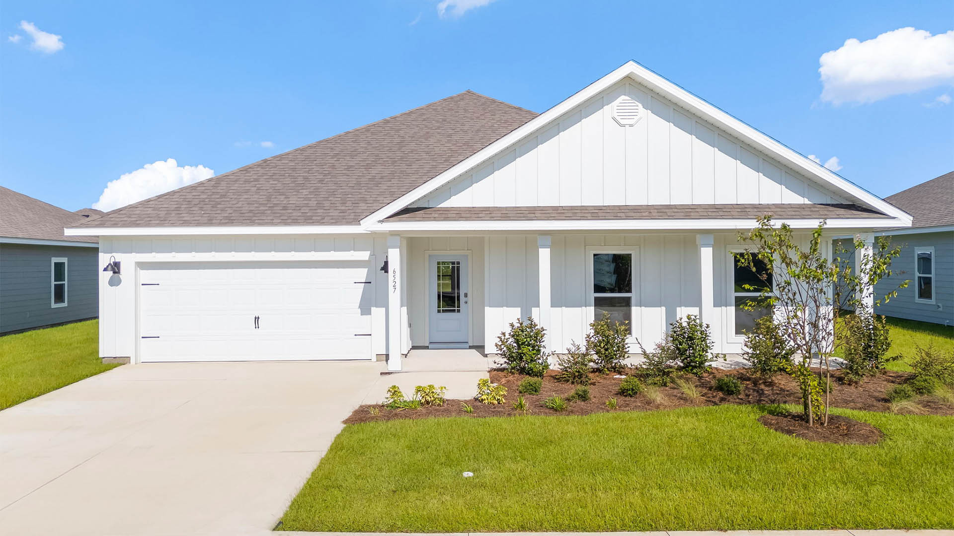 Victoria floor plan at Liberty with Hardie Board siding and large covered front porch and two car garage.