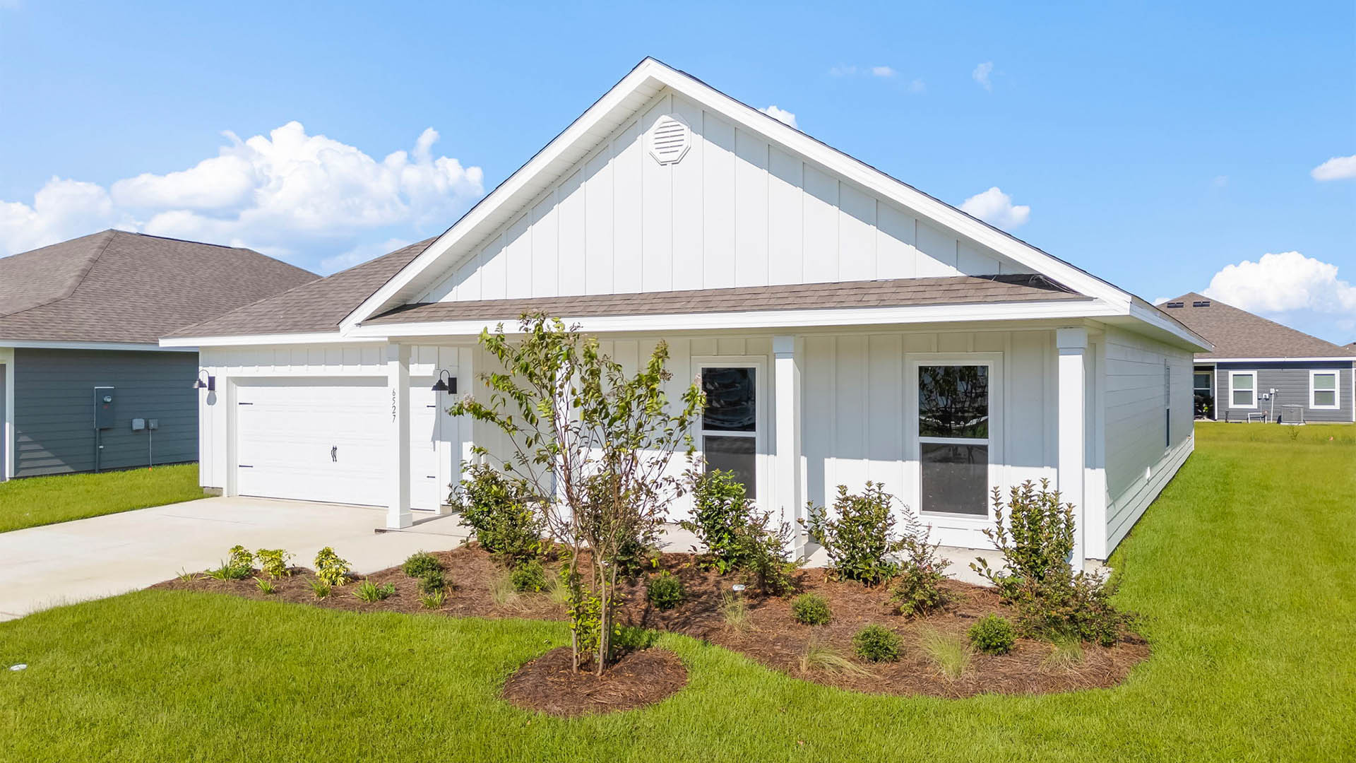 Victoria floor plan at Liberty with Hardie Board siding and large covered front porch and two car garage.