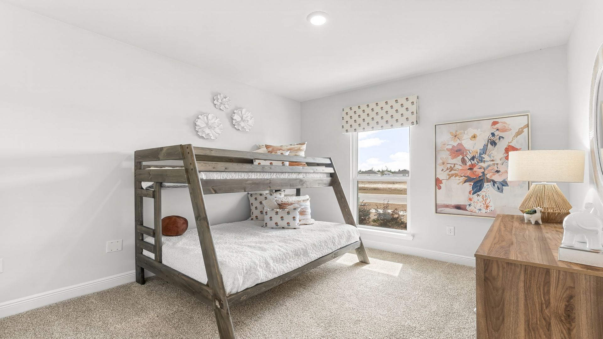 Bedroom with carpet floors and window.