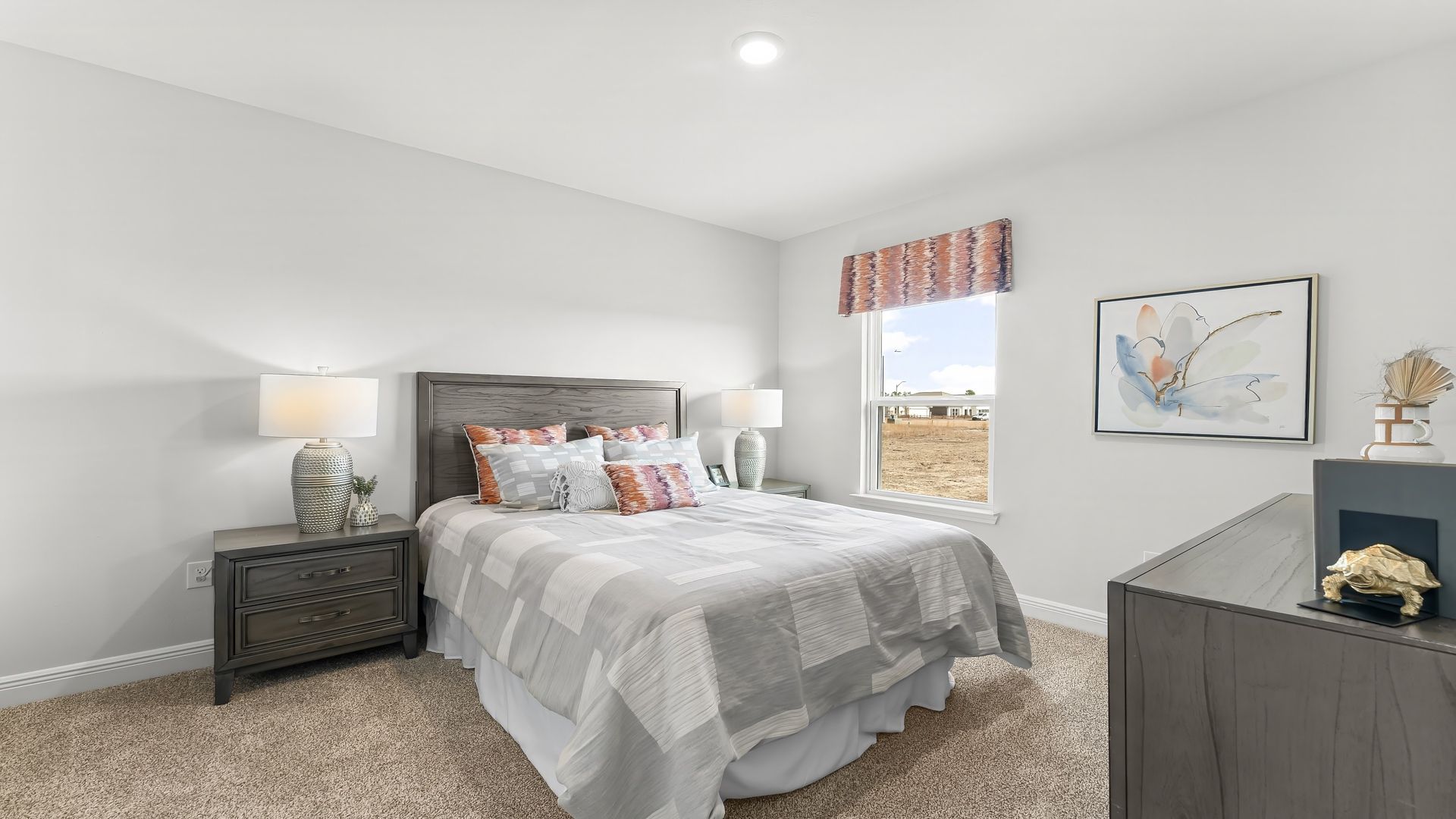 Bedroom with carpet floors and window.