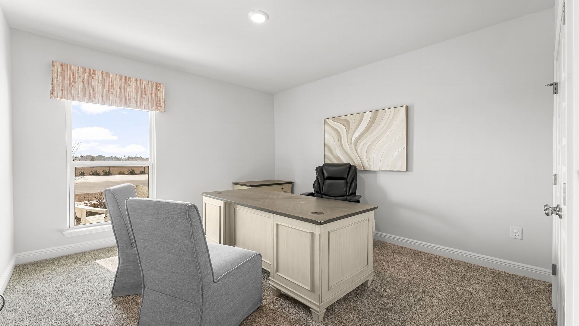 Bedroom with carpet floors and window.