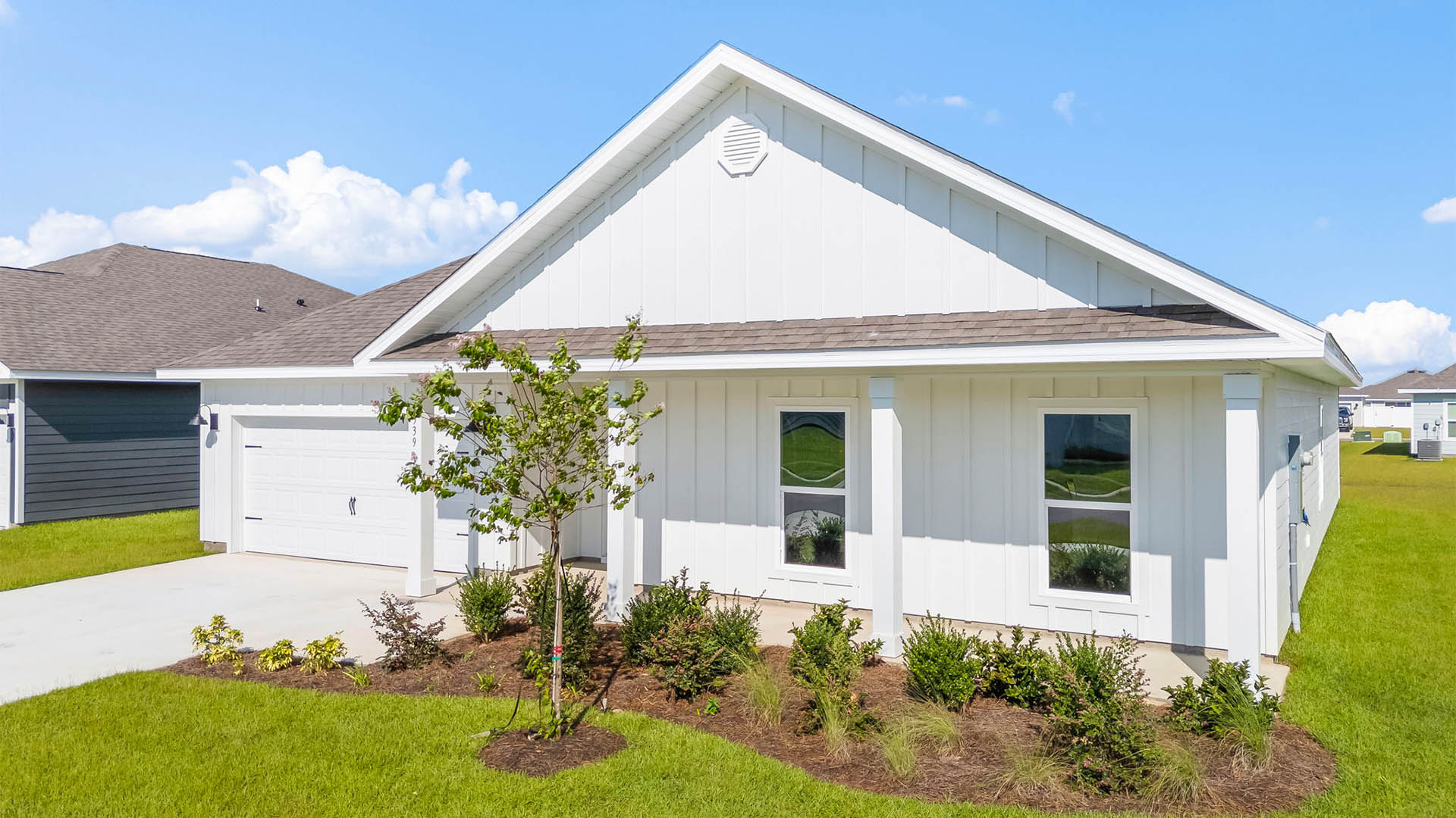 Victoria floor plan at Liberty with Hardie Board siding and large covered front porch and two car garage.