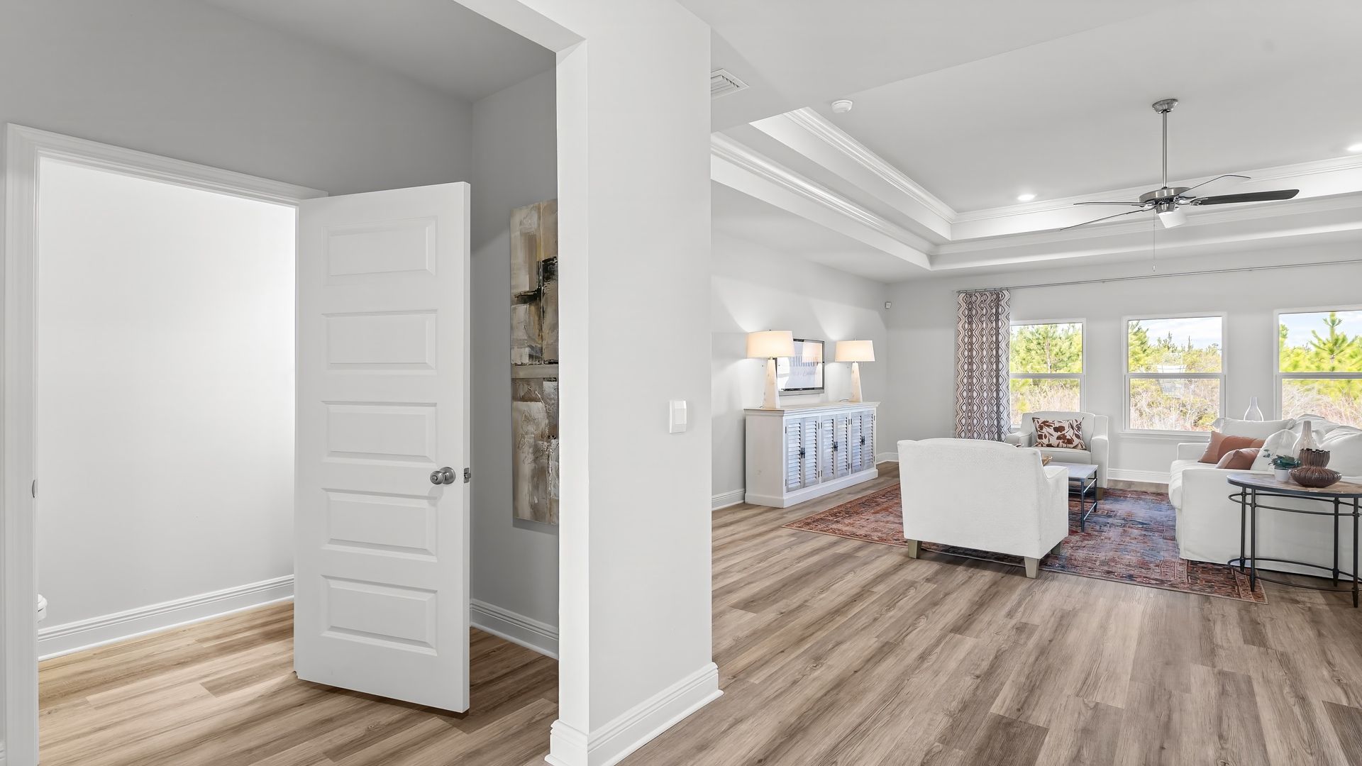 Hallway next to half bathroom and garage.