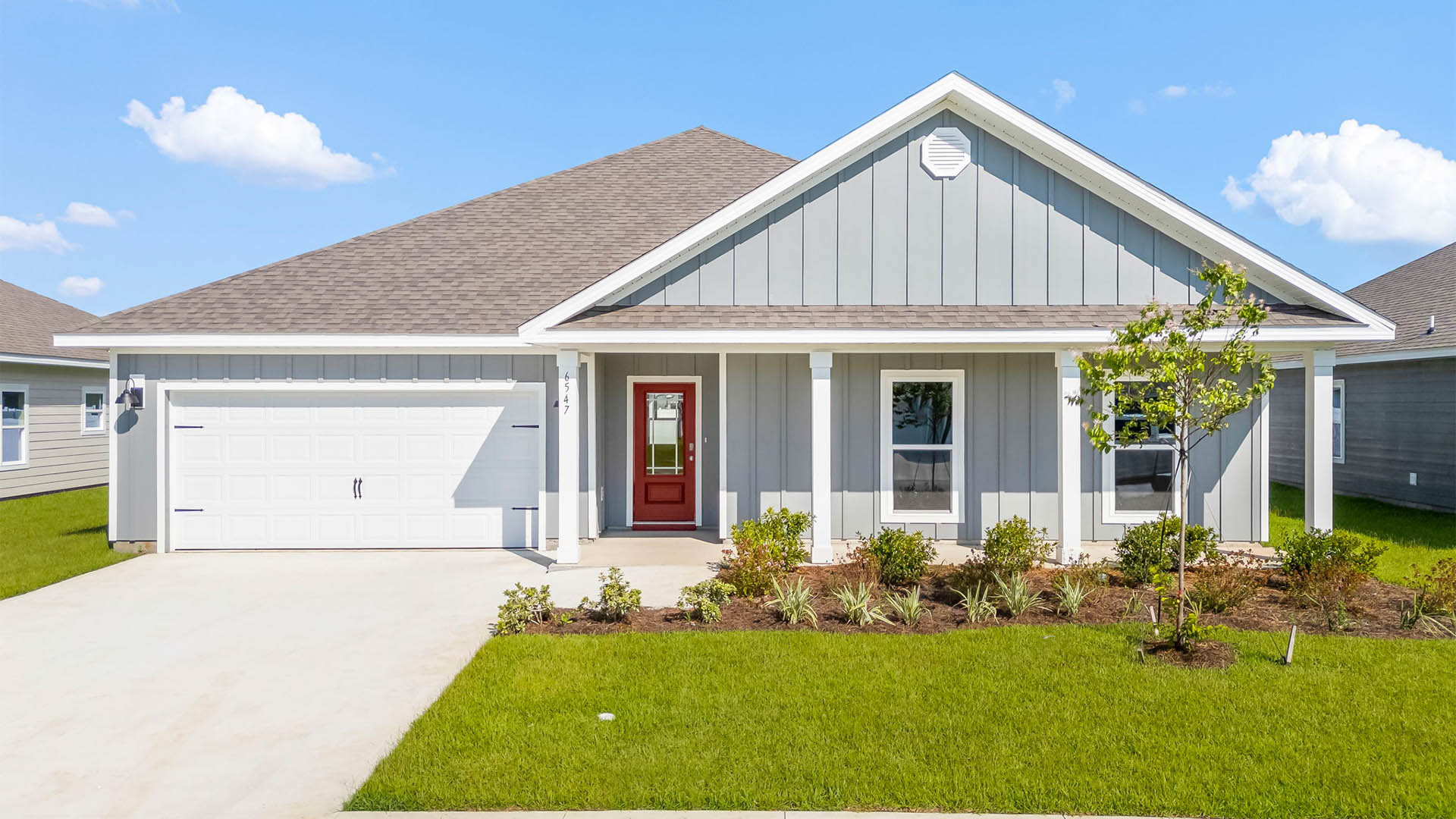 Victoria floor plan at Liberty with Hardie Board siding and large covered front porch and two car garage.