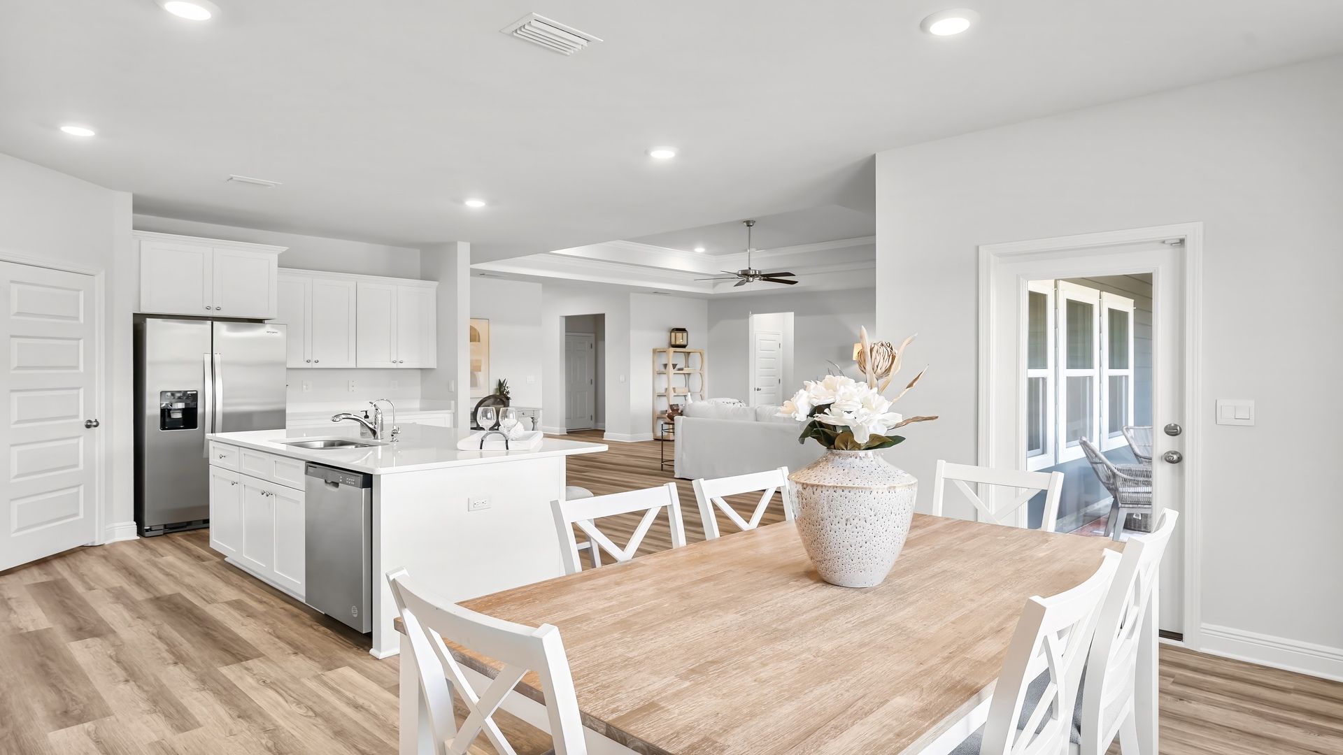 Dining area next to back door and kitchen.