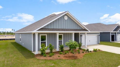 Victoria floor plan at Liberty with Hardie Board siding and large covered front porch and two car garage.
