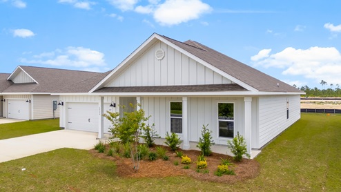 Victoria floor plan at Liberty with Hardie Board siding and large covered front porch and two car garage.