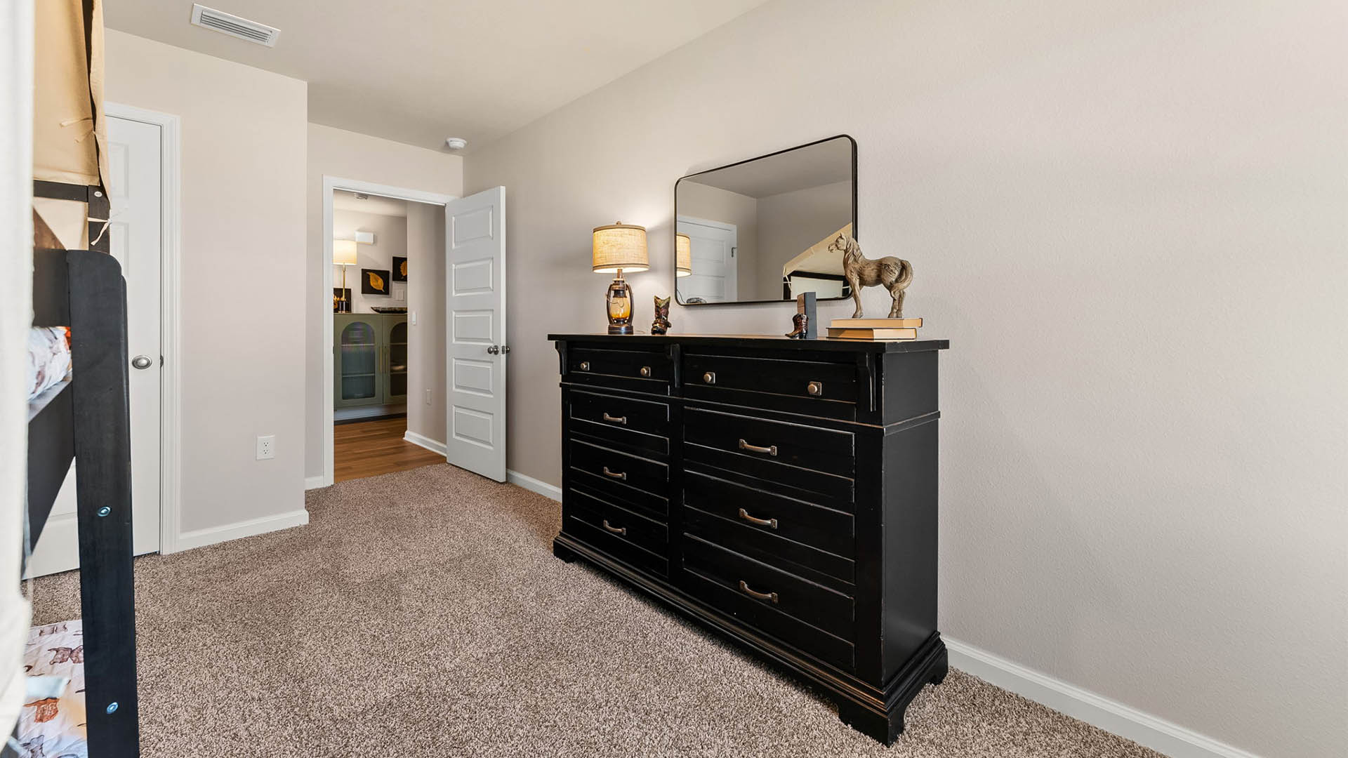 Bedroom with carpet floor and closet.
