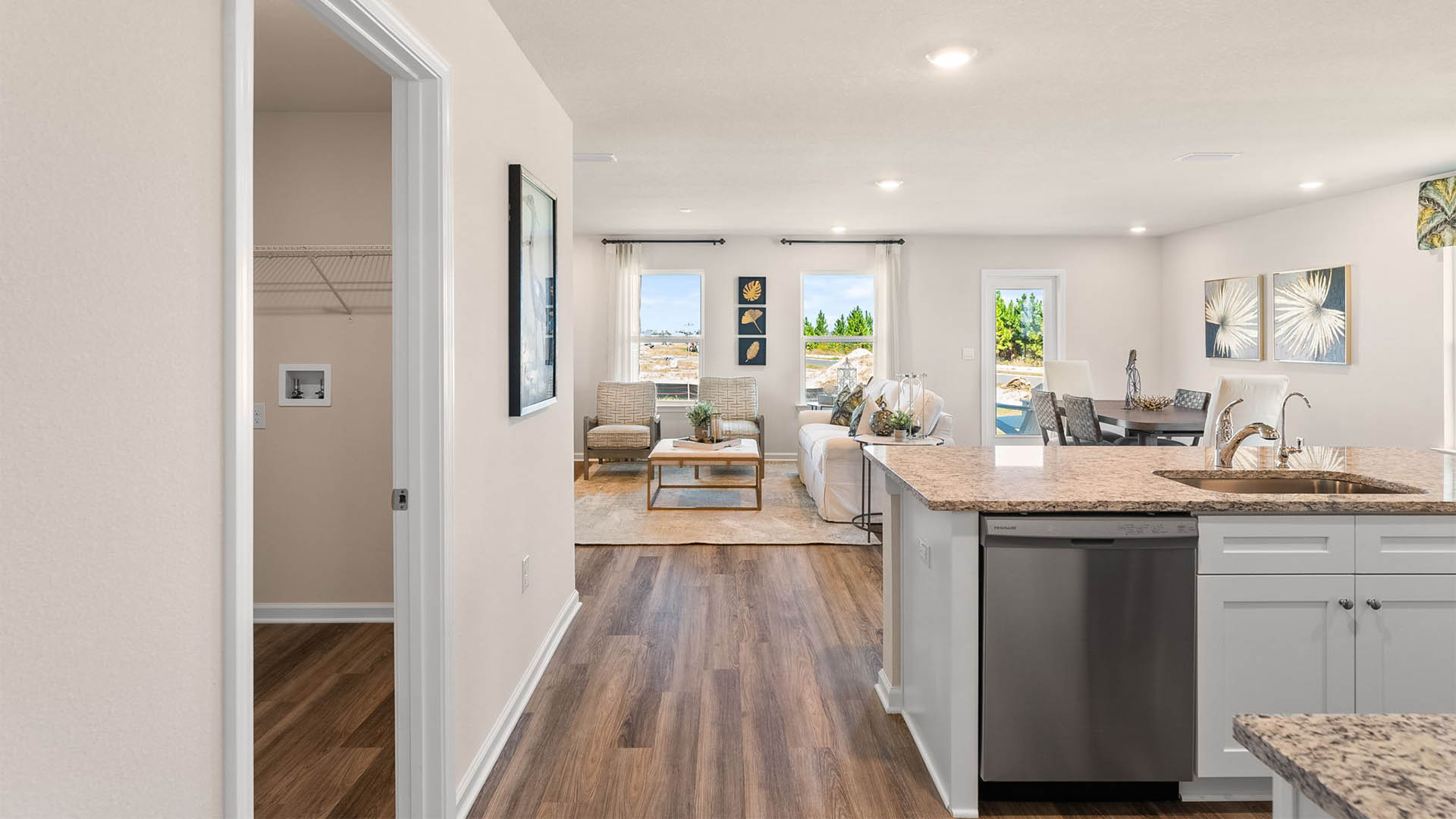 Entrance to open kitchen next to laundry room.