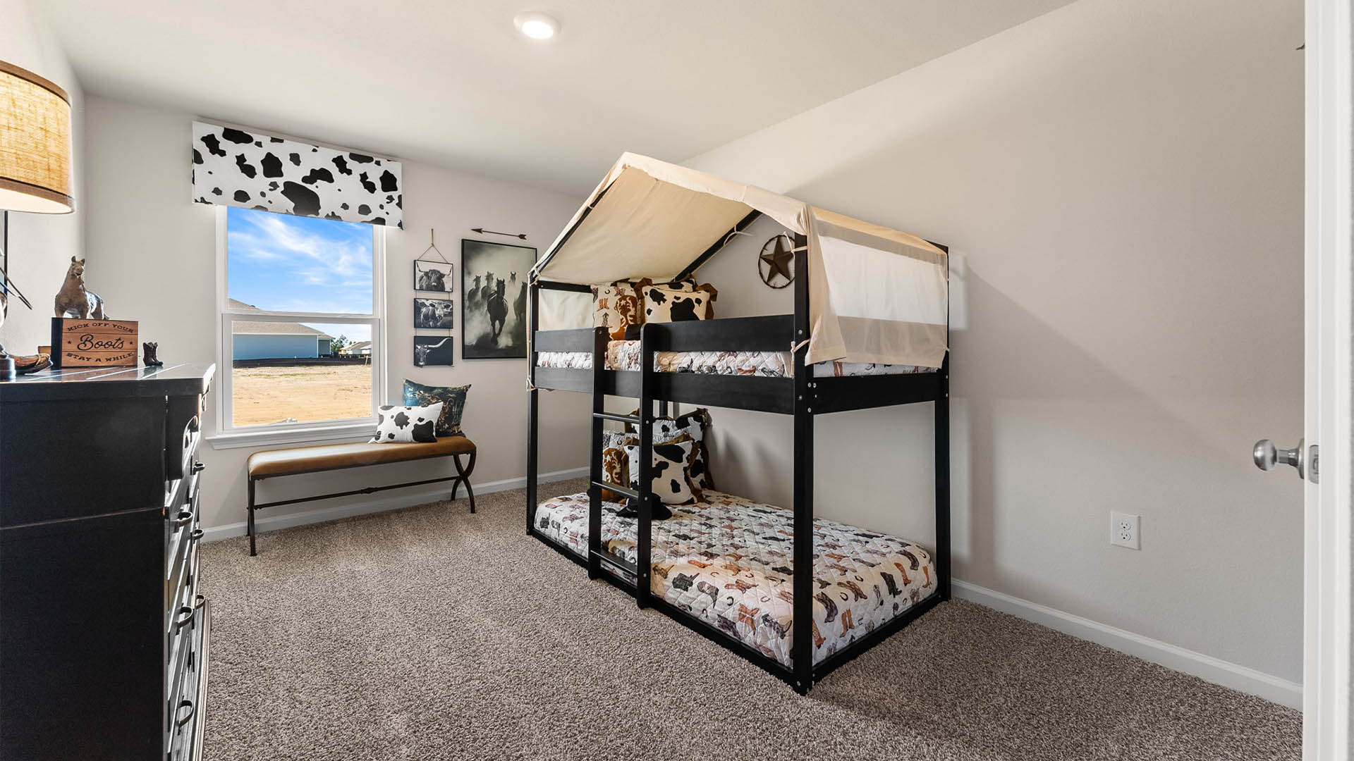 Bedroom with carpet floor and window.