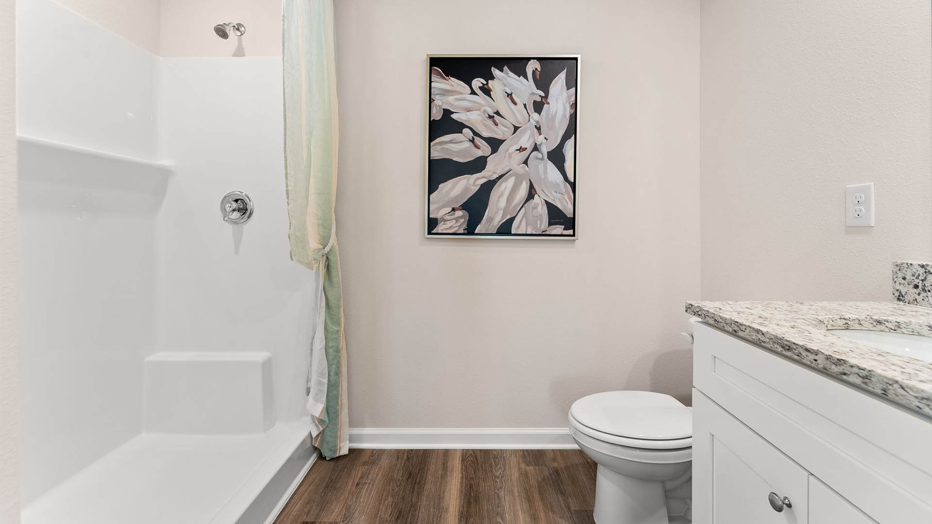 Primary bathroom shower and toilet.