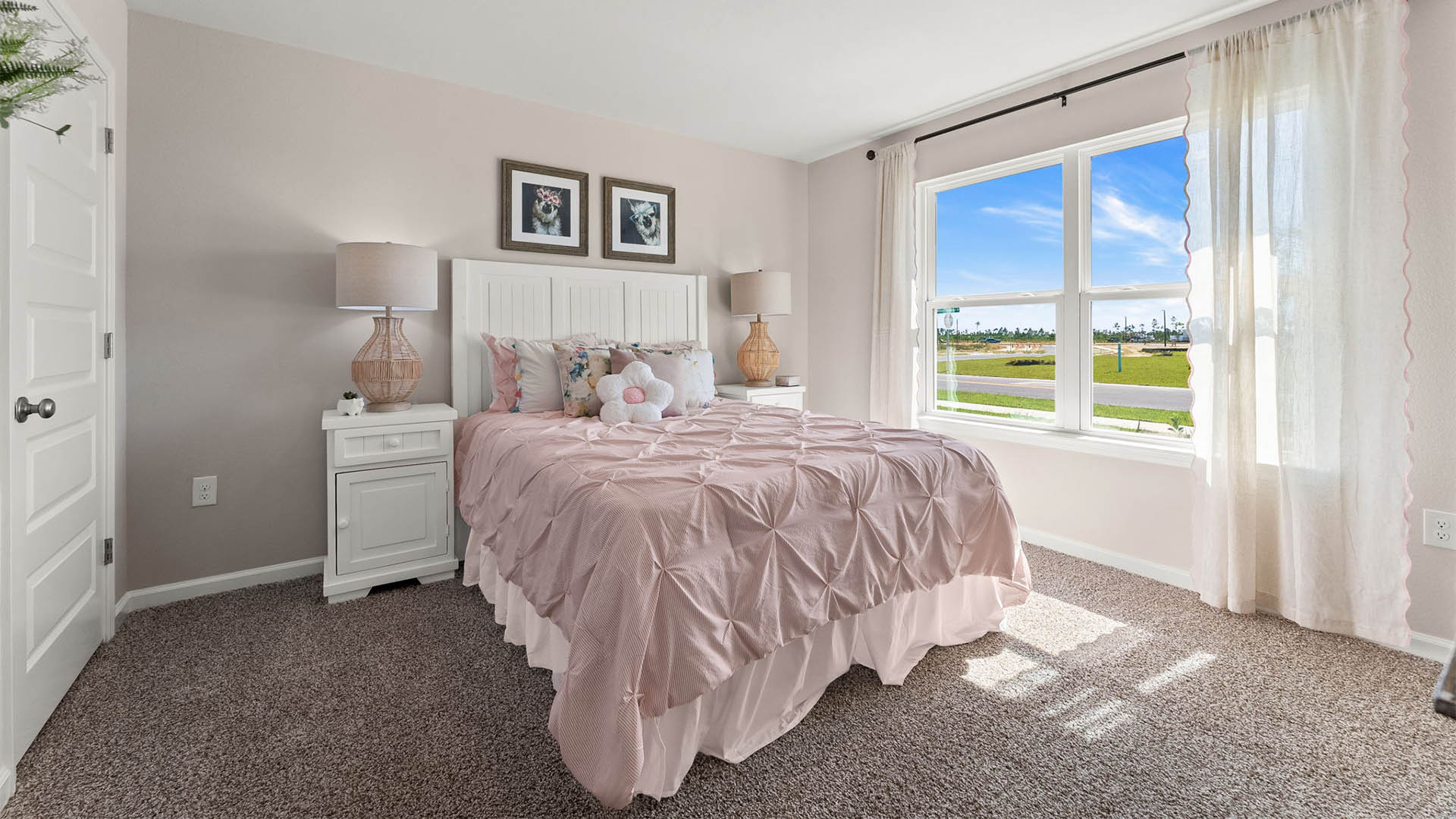 Bedroom with carpet floor and window.