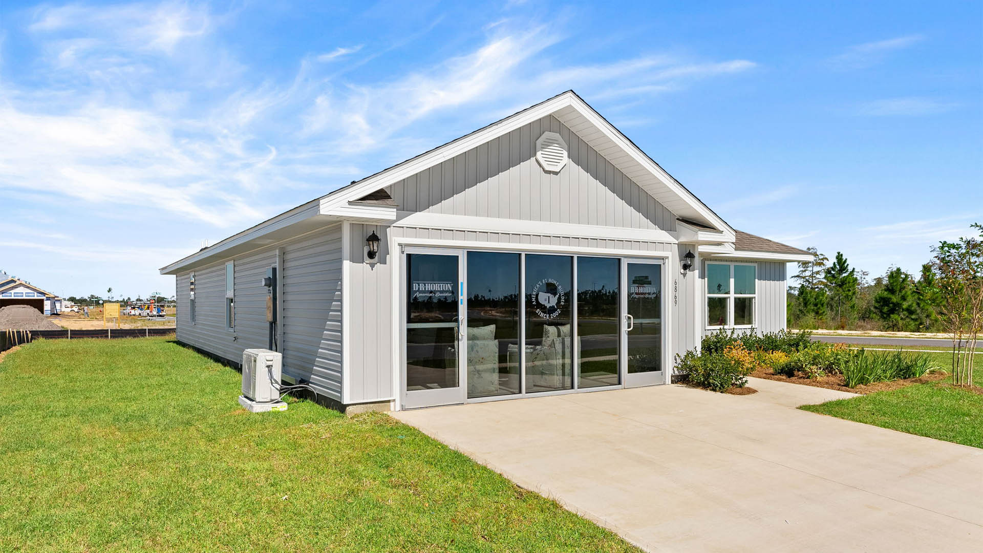 Lismore front of home with vinyl siding and two car garage.