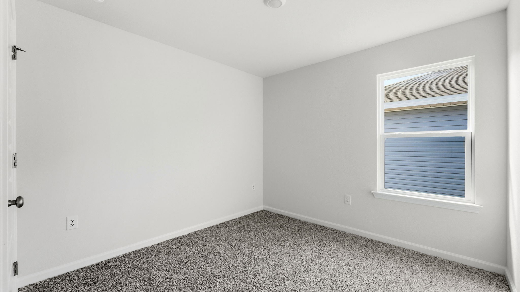 Bedroom with carpet floors and window and closet.