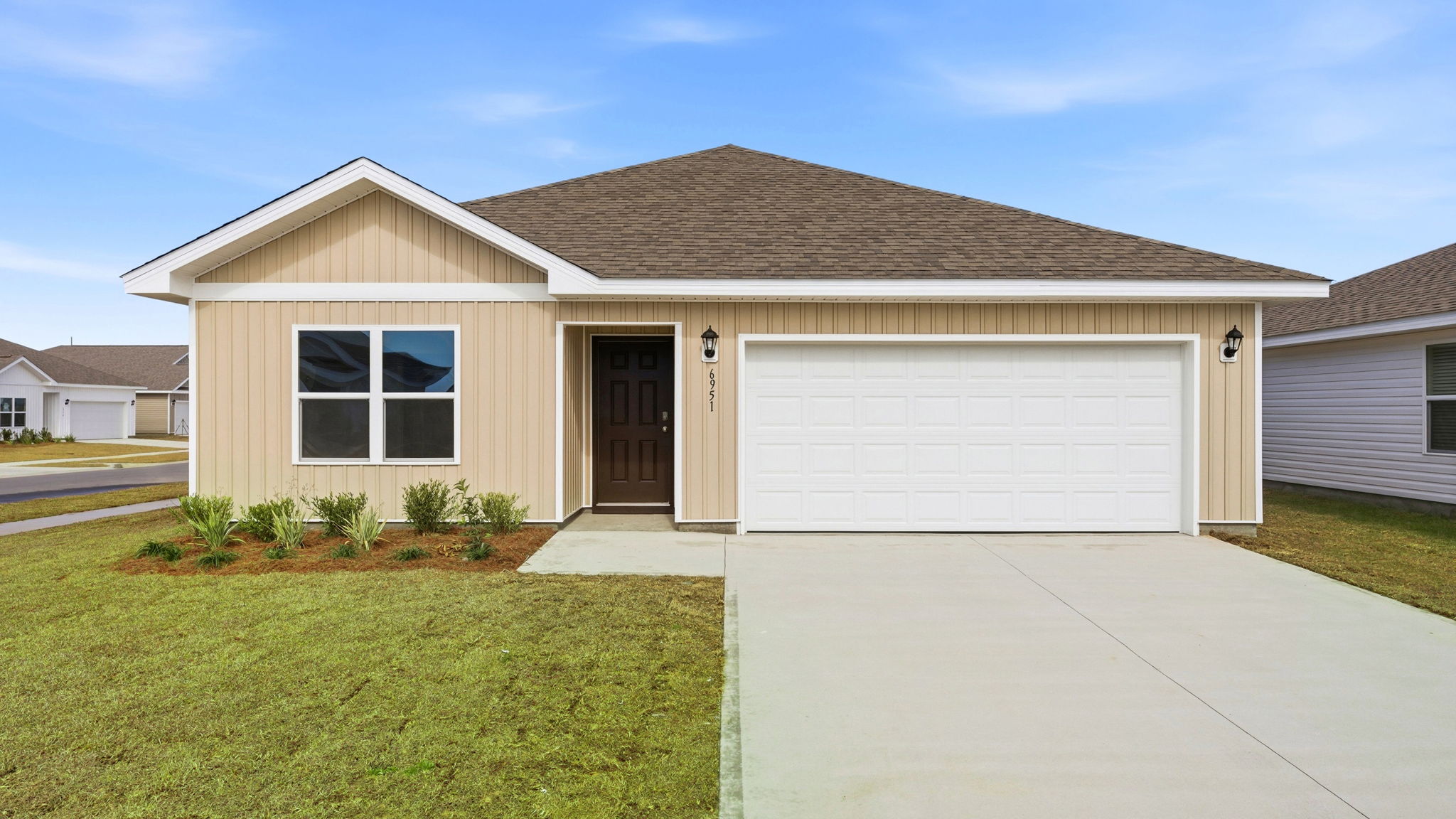 Aldridge plan with vinyl siding and two car garage.