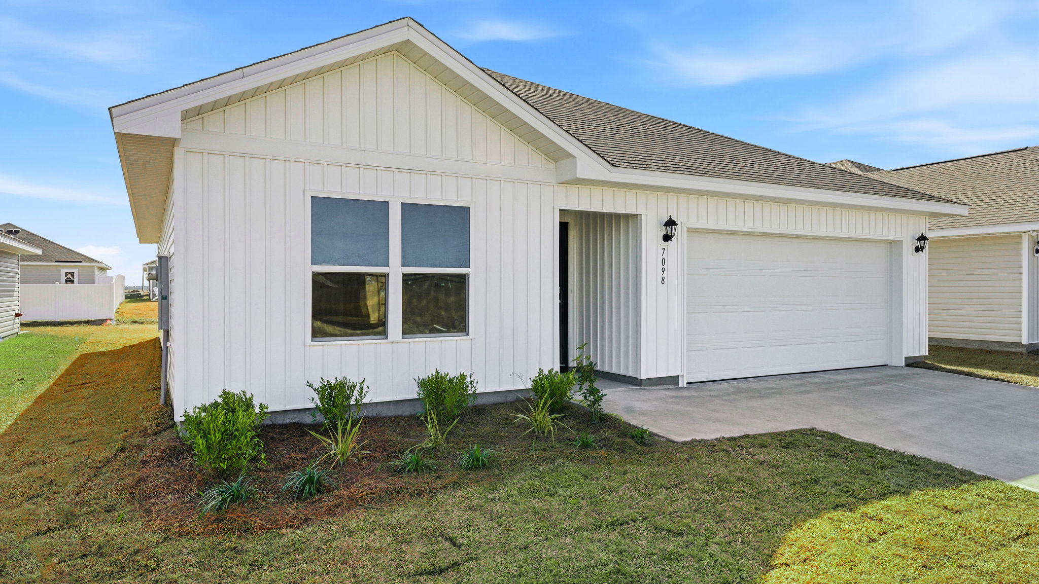 Aldridge plan with vinyl siding and two car garage.