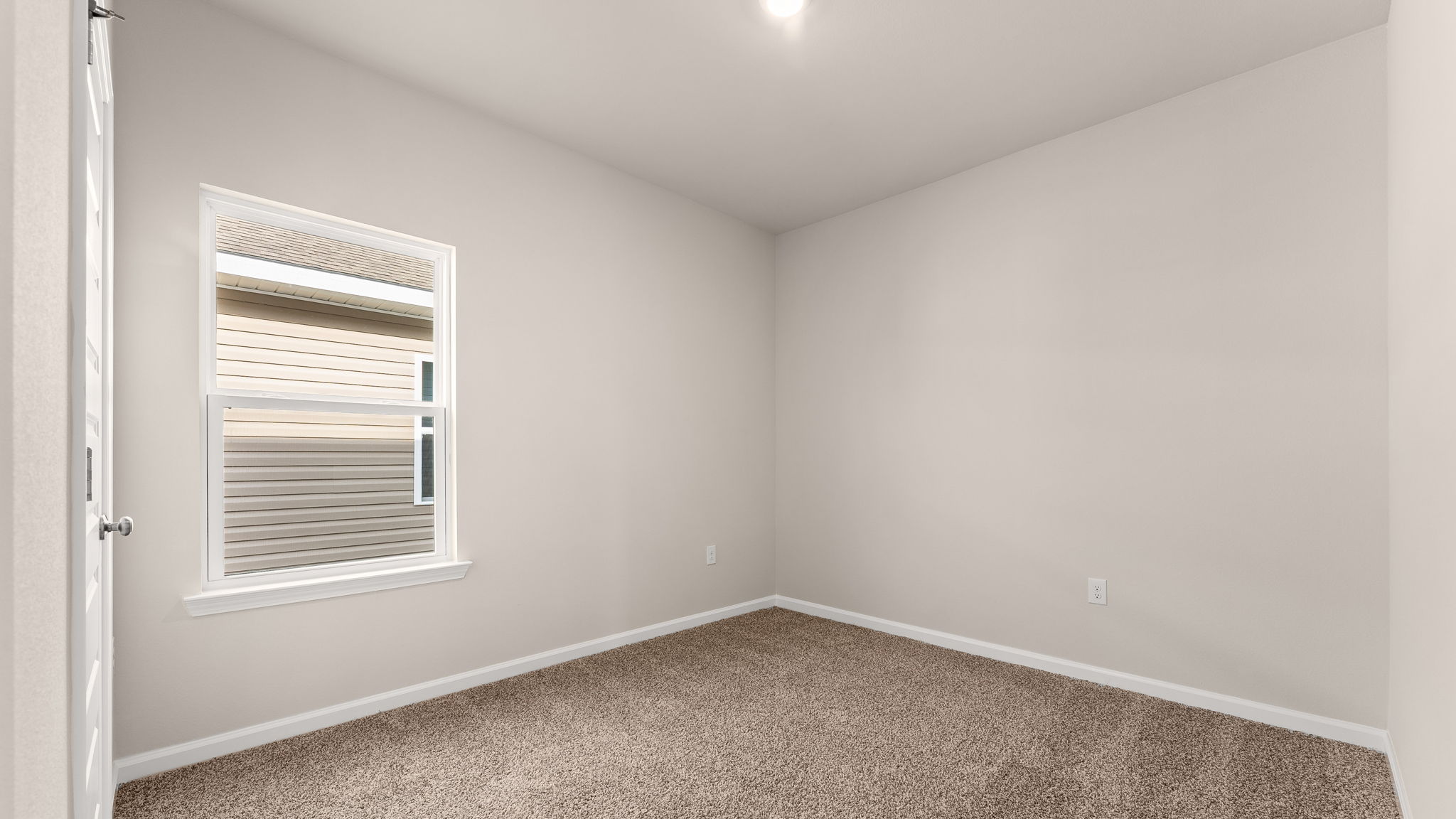 Bedroom with carpet floor and window and closet.