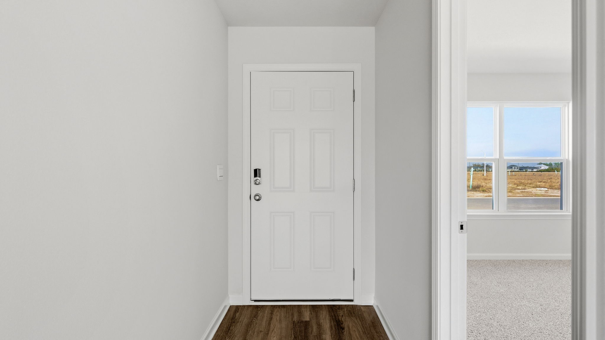 Front entrance hallway next to primary bedroom.