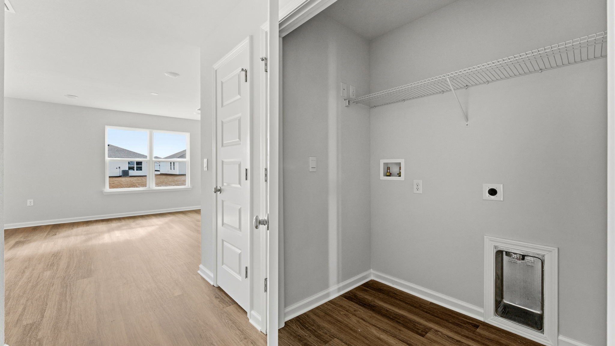 Laundry room with ventilated shelving.