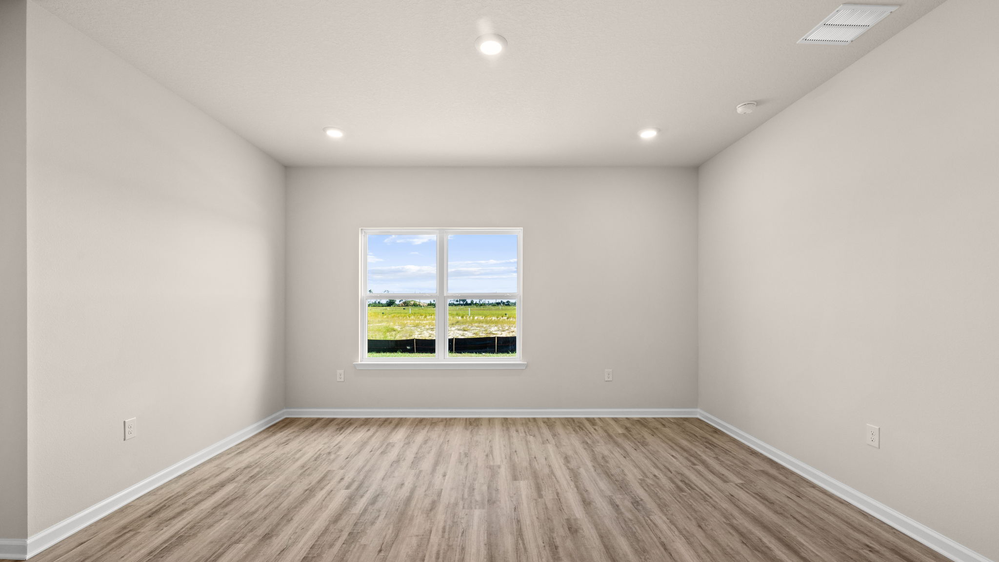 Living room and windows next to primary bedroom.