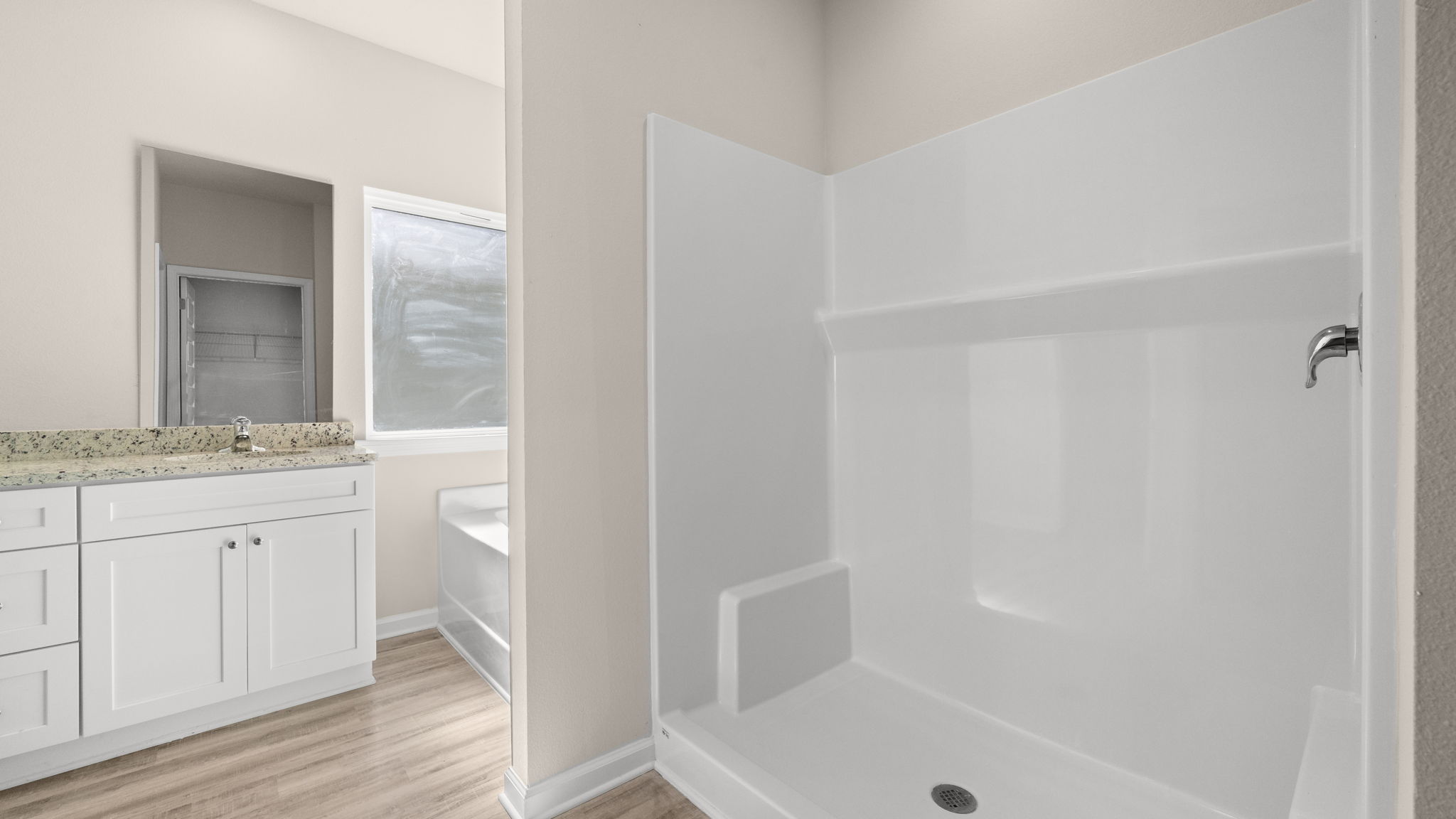 Primary bathroom shower and tub.